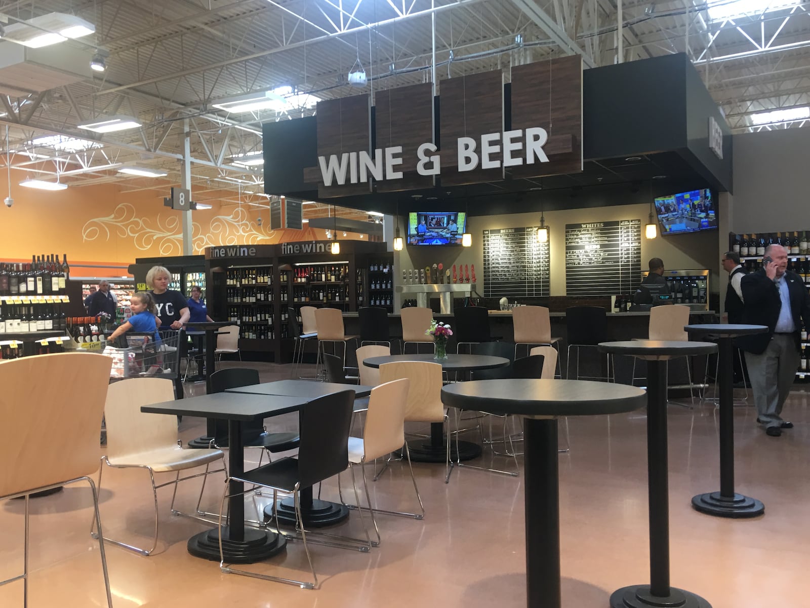 Customers can stop for a wine or beer on tap in the Cornerstone of Centerville Kroger. The store has tables and a bar available for shoppers who want to stop and an enjoy a drink or one of the ready-to-order food products. KARA DRISCOLL/STAFF