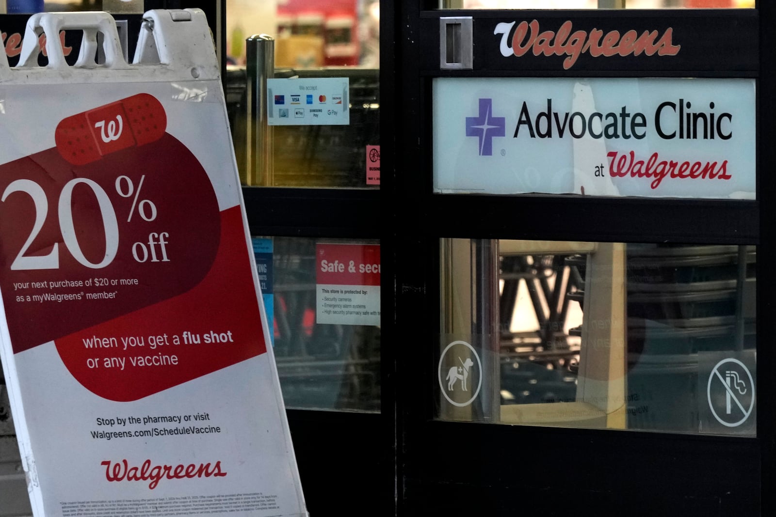 The entrance to a Walgreens drugstore in Wheeling, Ill., is shown on Tuesday, Oct. 15, 2024. (AP Photo/Nam Y. Huh)