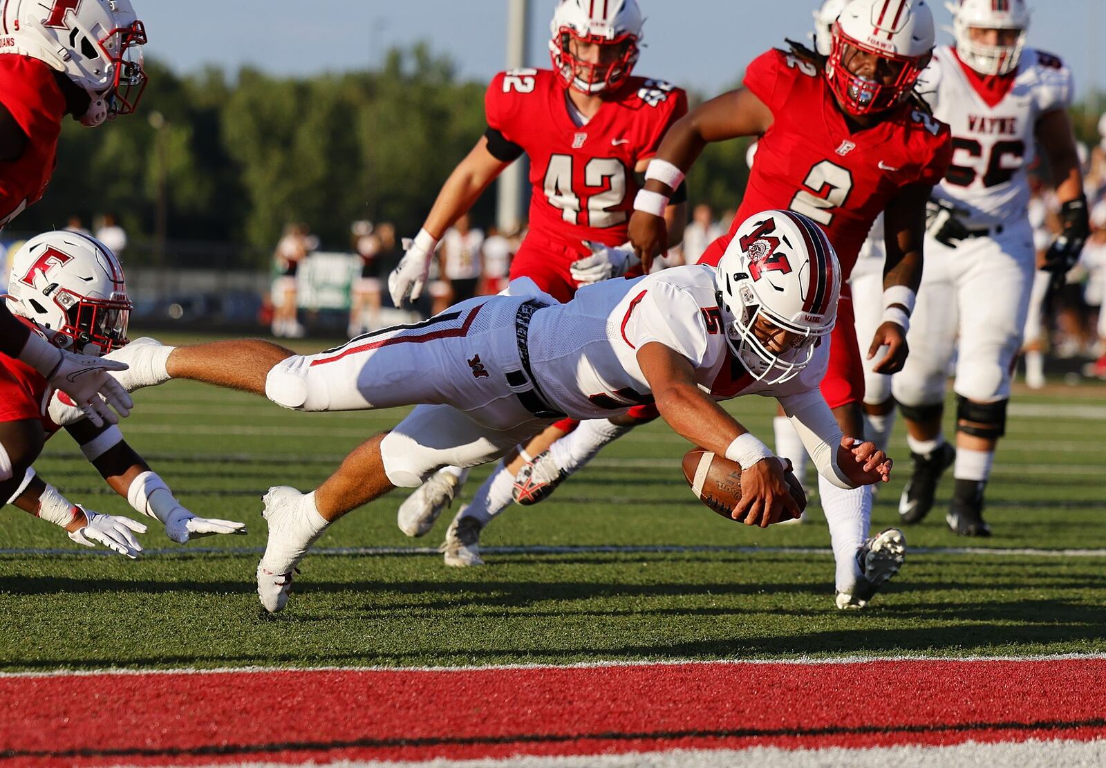 Wayne quarterback Tyrell Lewis dives in for a touchdown during their 41-24 loss to Fairfield Thursday, Aug. 18, 2022 at Fairfield Stadium. NICK GRAHAM/STAFF