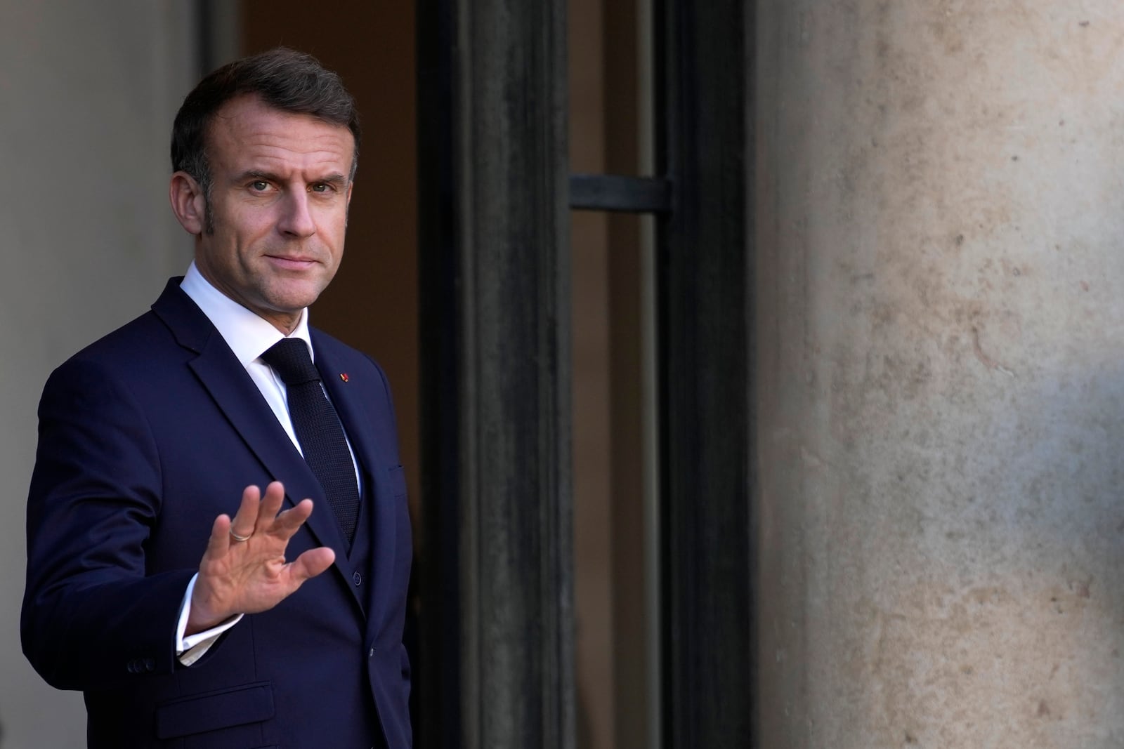 French President Emmanuel Macron gestures Wednesday, Oct. 23, 2024 at the Elysee Palace in Paris. (AP Photo/Louise Delmotte)