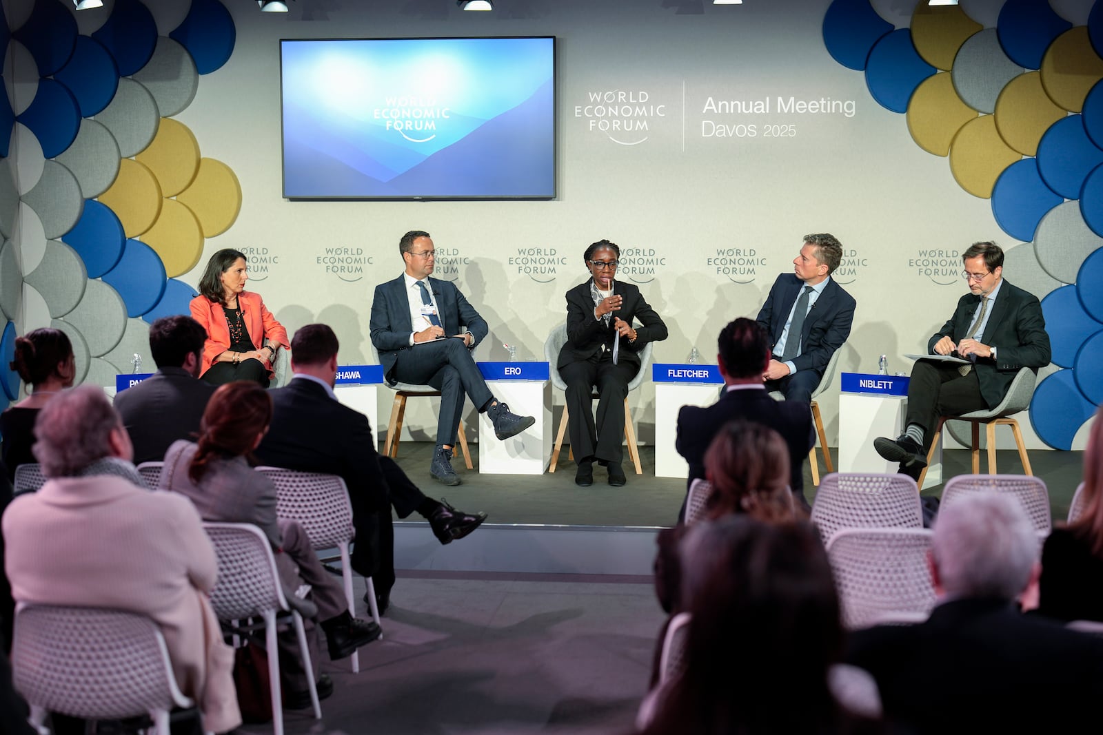 Tom Fletcher, under-secretary-general for Humanitarian Affairs and Emergency Relief Coordinator, 2nd right, Comfort Pro, centre, Hashim Shawa, 2nd left, and Sara Pantuliano, left, talkduring a briefing on the humanitarian situation in Gaza at the Annual Meeting of World Economic Forum in Davos, Switzerland, Tuesday, Jan. 21, 2025. (AP Photo/Markus Schreiber)