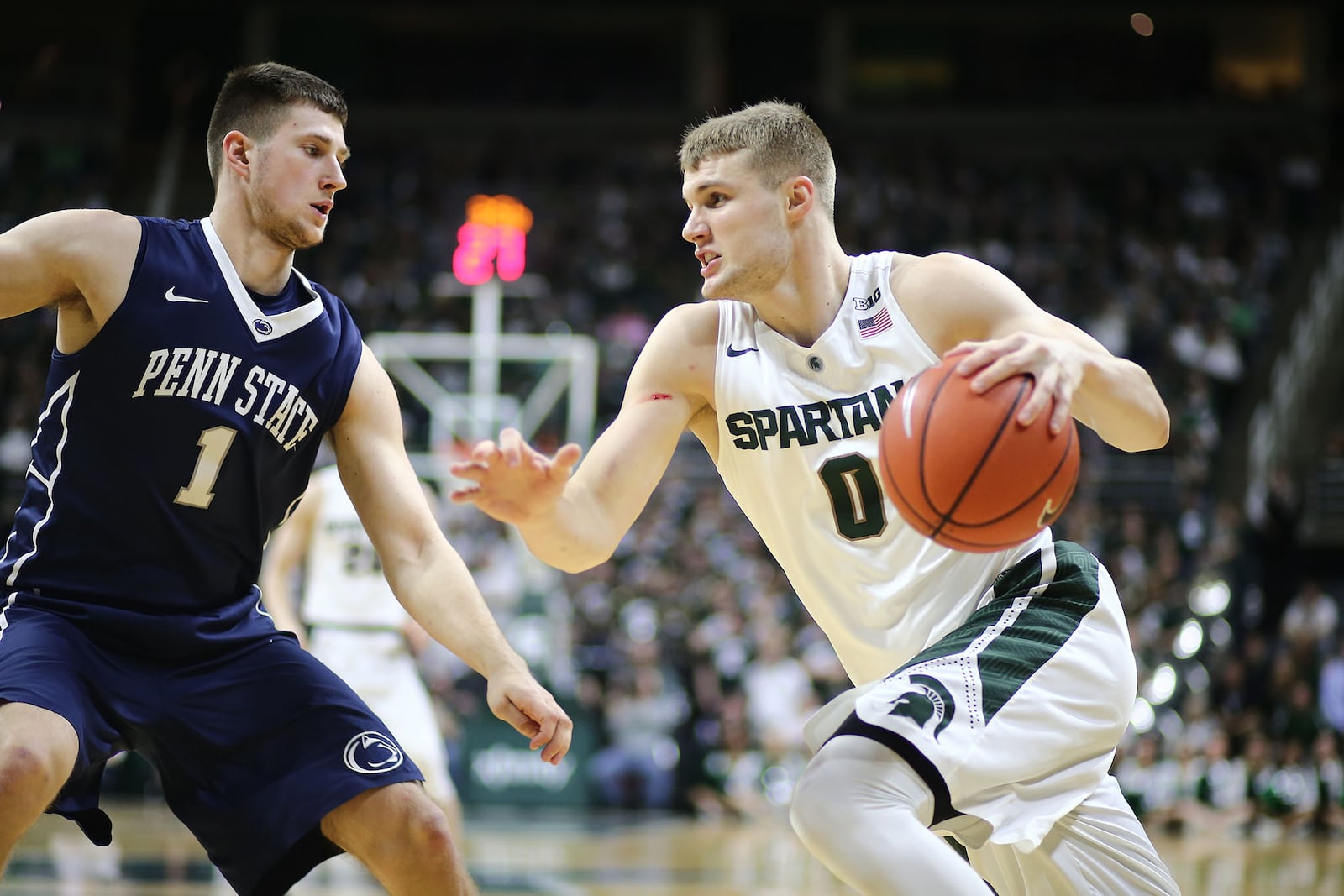 EAST LANSING, MI - FEBRUARY 28: Kyle Ahrens #0 of the Michigan State Spartans drives baseline against Deividas Zemgulis #1 of the Penn State Nittany Lions in the second half at the Breslin Center on February 28, 2016 in East Lansing, Michigan. (Photo by Rey Del Rio/Getty Images)