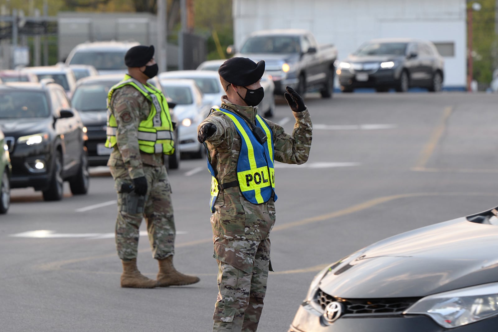 Personnel from the 88th Security Forces Squadron direct traffic entering Gate 12A as it flows through all lanes on April 19 at Wright-Patterson Air Force Base. U.S. AIR FORCE PHOTO/TY GREENLEES