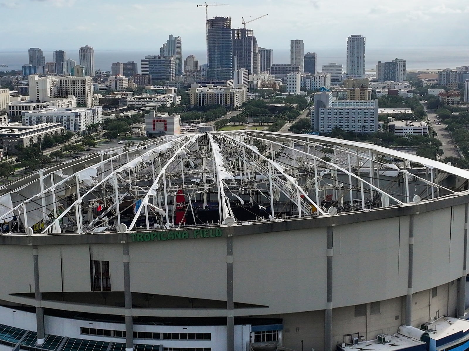 An aerial drone view shows Tropicana Field with the roof damaged after Hurricane Milton in downtown St. Petersburg, Fla., on Thursday, Oct. 10, 2024. (Dirk Shadd/Tampa Bay Times via AP)