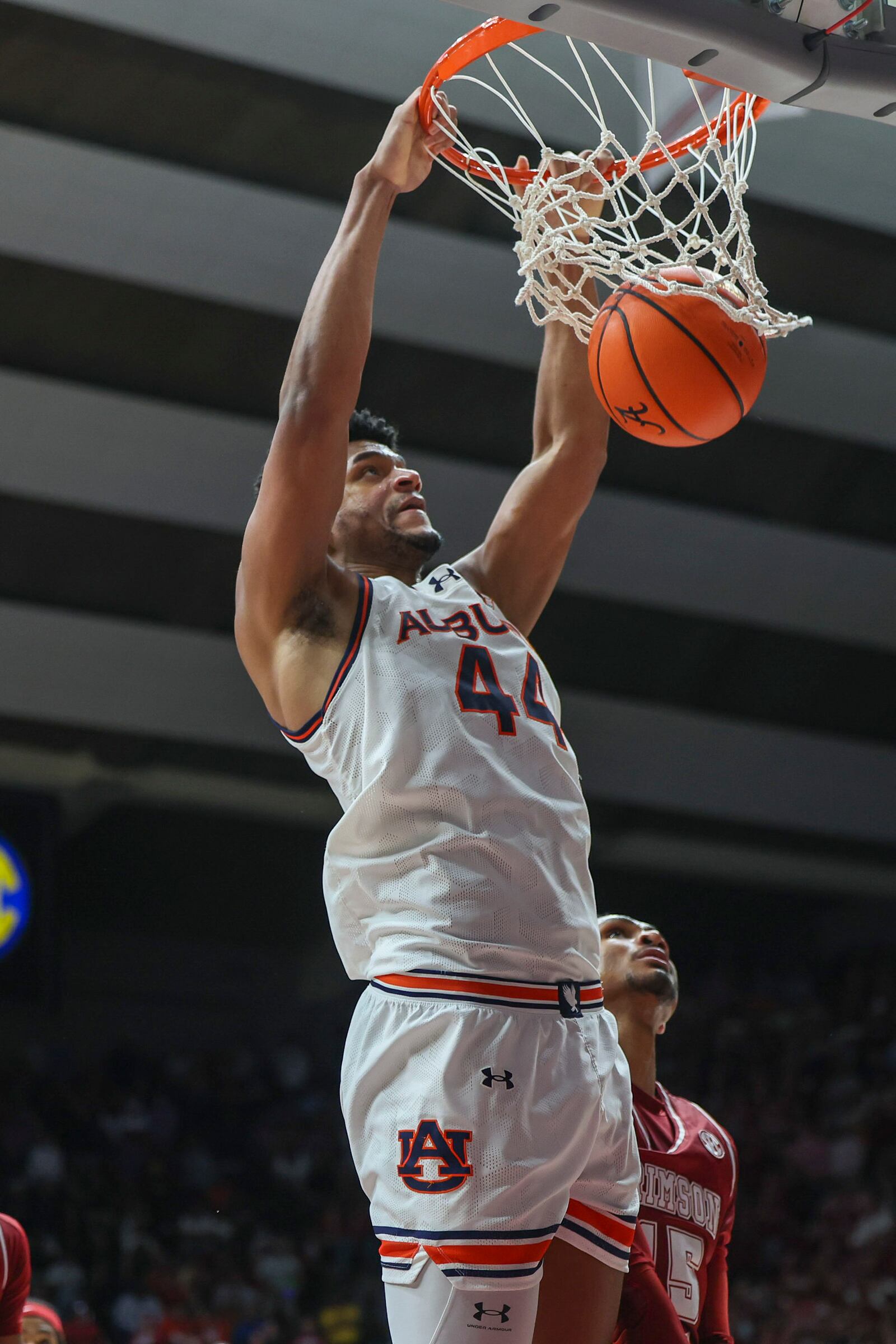 Auburn's Dylan Cardwell (44) dunks on Alabama during the first half of an NCAA college basketball game, Saturday, Feb. 15, 2025, in Tuscaloosa, Ala. (AP Photo/Vasha Hunt)