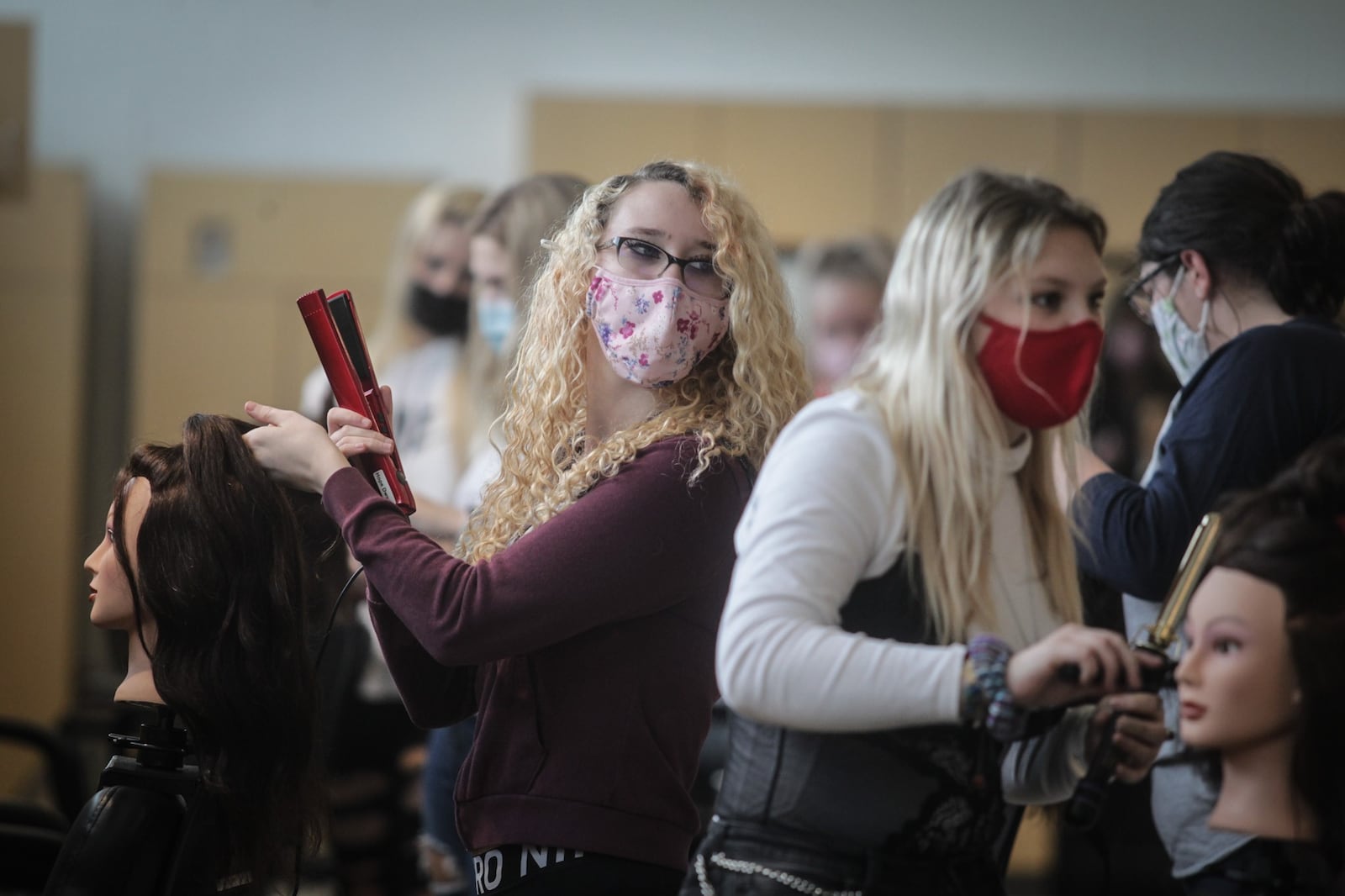 Kettering Fairmont High School CTC students from left, Hope Dwyer and Victoria Lewis works in the cosmetology classroom Thursday Jan. 14, 2021. Kettering schools is renovating part of it's career technology center to start a new program in Medical Assistance.