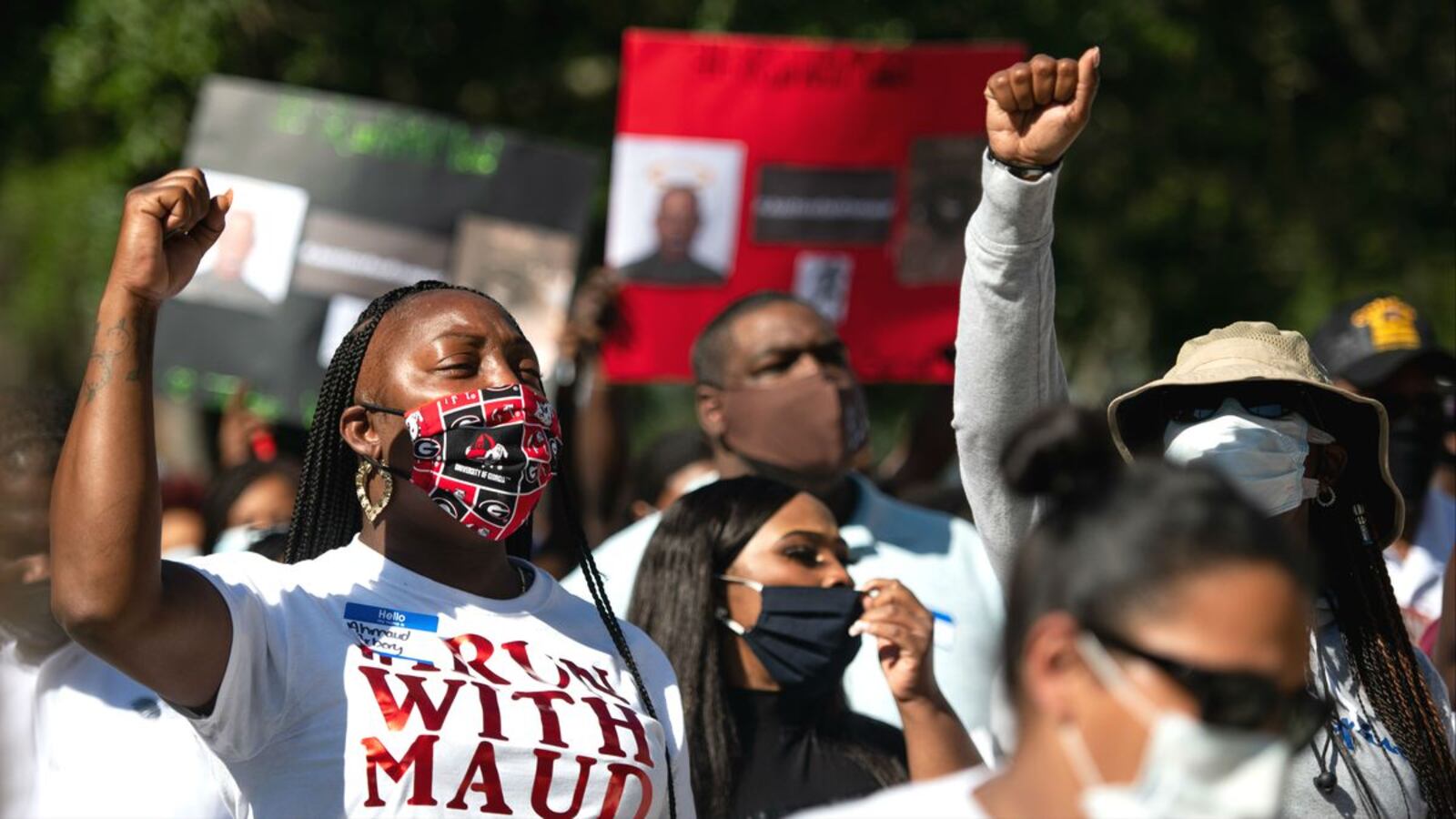 Protesters are seen rallying for slain black jogger Ahmaud Arbery Friday, May 8, 2020, outside the Glynn County Courthouse, in Brunswick, Ga. Travis McMichaels, 34, and his father, 64-year-old Gregory McMichaels, are charged with felony murder and aggravated assault in the Feb. 23 shooting of Arbery, who was jogging in their predominantly white neighborhood. (Sean Rayford/Getty Images)