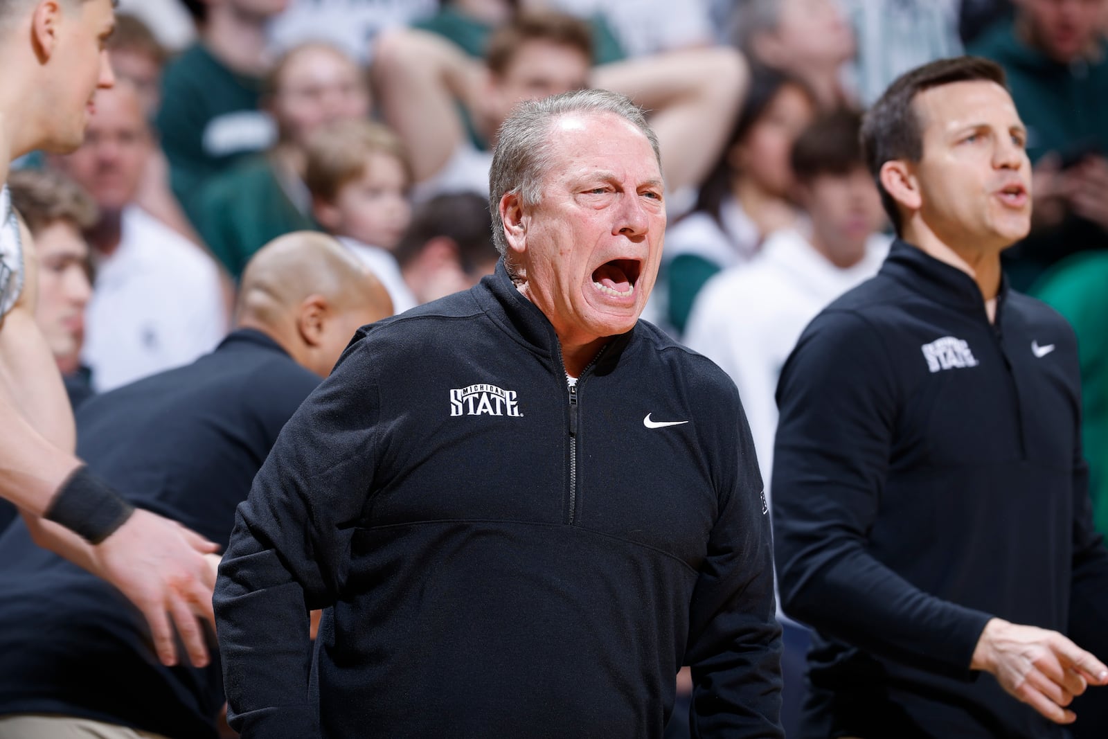 Michigan State coach Tom Izzo, center, reacts during the first half of an NCAA college basketball game against Wisconsin, Sunday, March 2, 2025, in East Lansing, Mich. (AP Photo/Al Goldis)