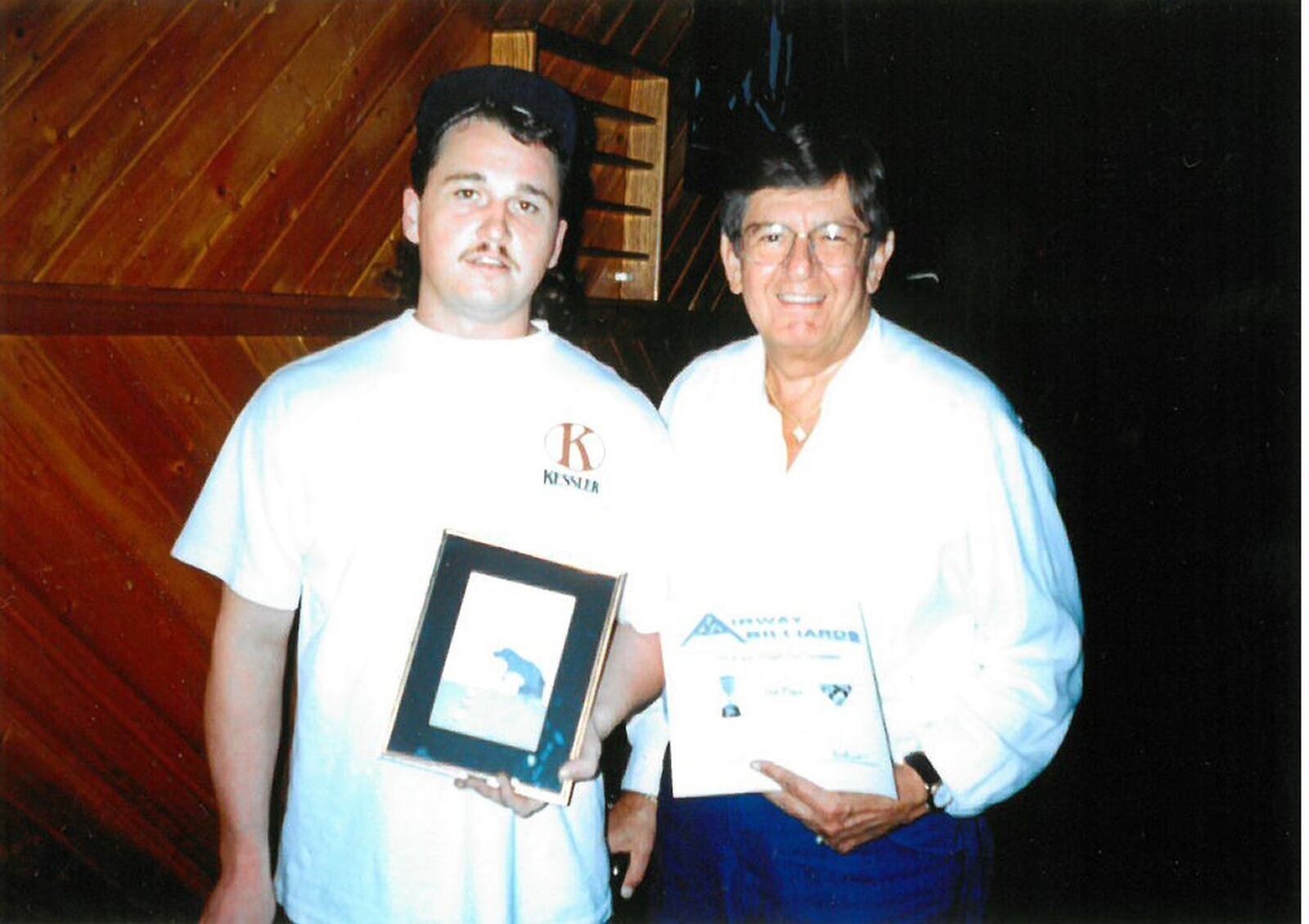 Deeno Gounaris in mid-1980s standing alongside Jason Miller, the two-time world bank champion and former world all-around champ. FAMILY PHOTO