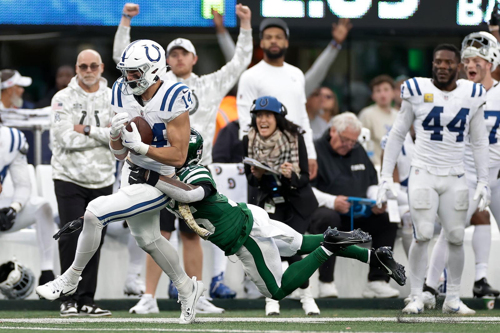 Indianapolis Colts wide receiver Alec Pierce (14) makes a catch against New York Jets safety Jalen Mills (35) for a first down during the fourth quarter of an NFL football game, Sunday, Nov. 17, 2024, in East Rutherford, N.J. (AP Photo/Adam Hunger)