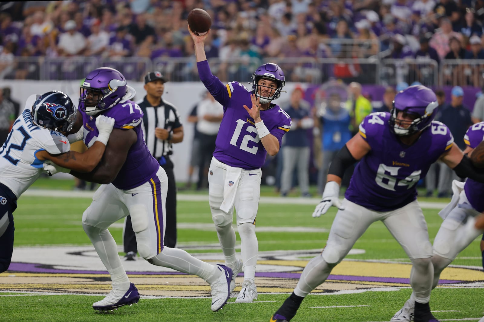 Minnesota Vikings quarterback Nick Mullens (12) throws a pass from the pocket in the first half of a preseason NFL football game against the Tennessee Titans, Saturday, Aug. 19, 2023, in Minneapolis. (AP Photo/Bruce Kluckhohn)