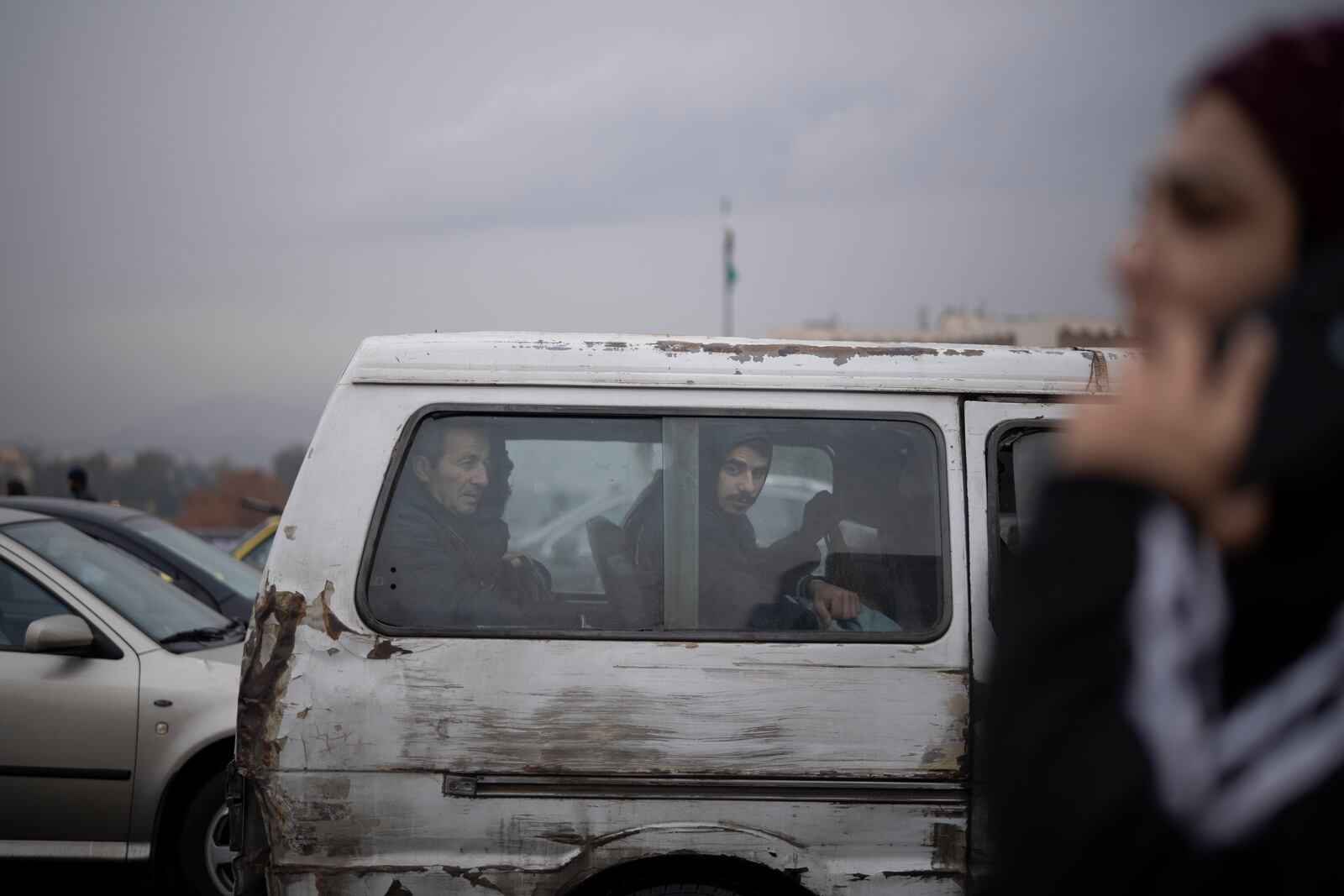 Commuters ride on a transportation van in Damascus, Syria, Sunday, Dec. 29, 2024. (AP Photo/Leo Correa)