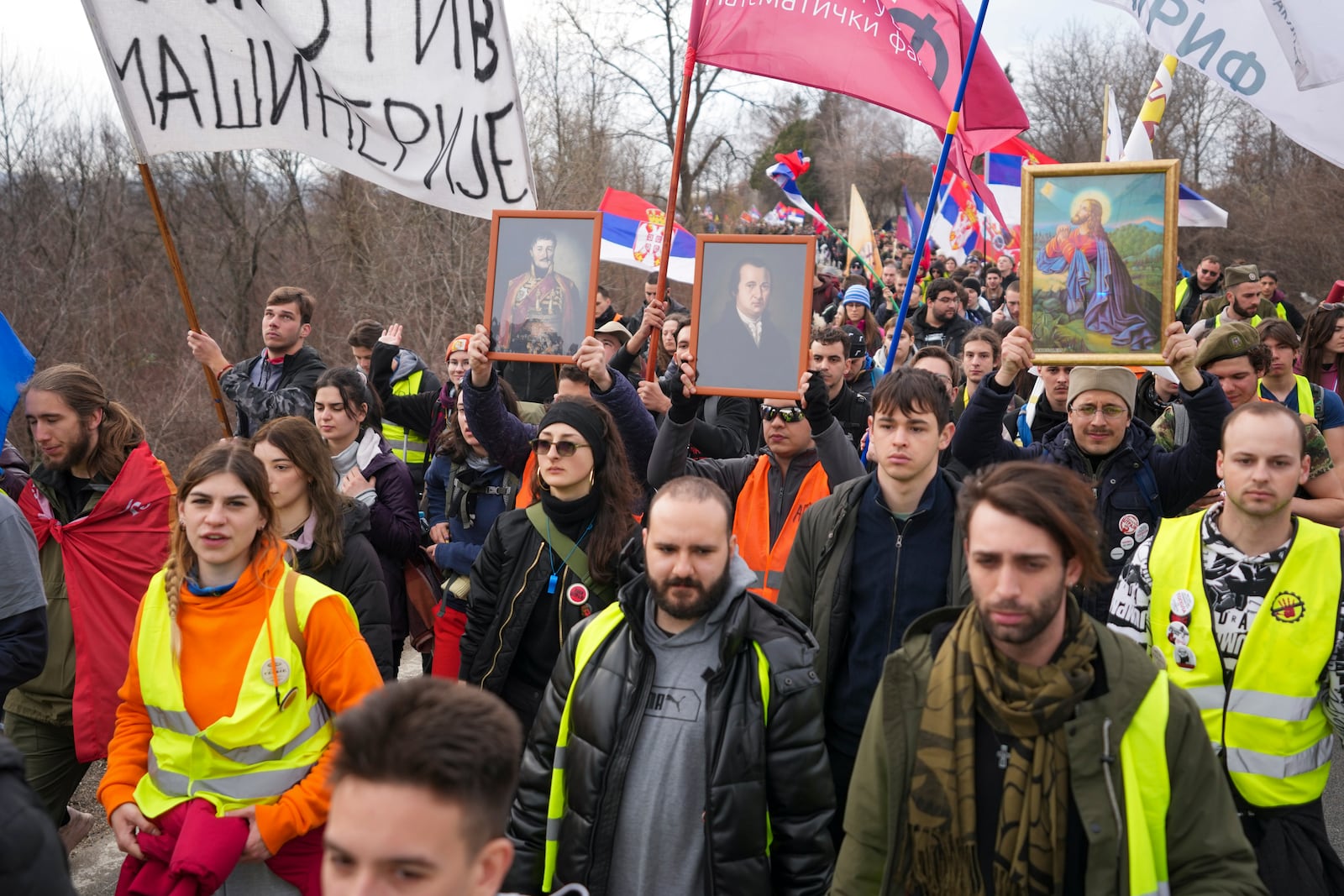 Students march near the village of Cumic near the Serbian industrial town of Kragujevac, to protest the deaths of 15 people killed in the November collapse of a train station canopy, Friday, Feb. 14, 2025. (AP Photo/Darko Vojinovic)