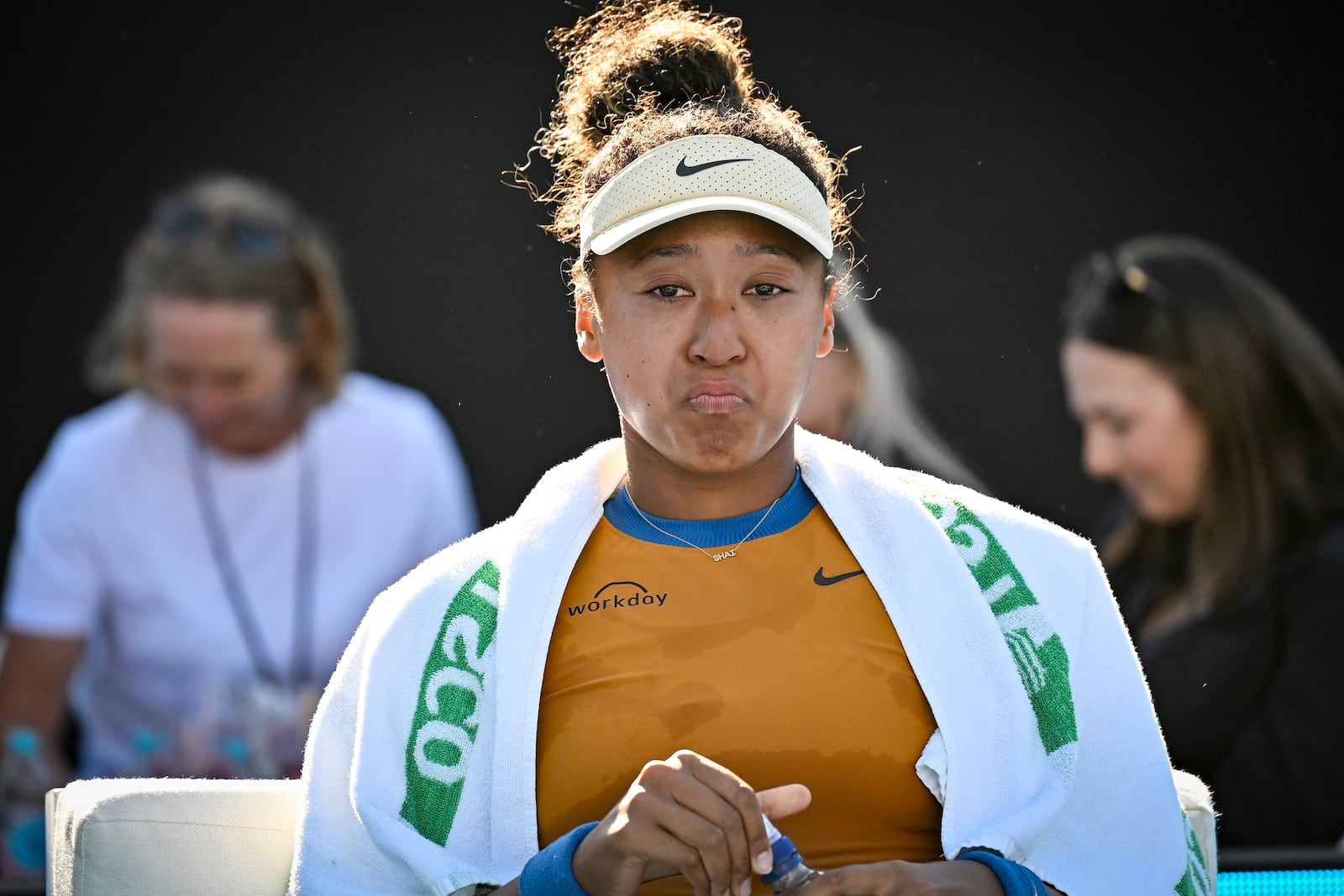 Naomi Osaka of Japan is emotional after forfeiting her match against Clara Tauson of Denmark in the finals singles match of the ASB Classic tennis tournament at Manuka Doctor Arena in Auckland, New Zealand, Sunday, Jan. 5, 2025. (Alan Lee/Photosport via AP)