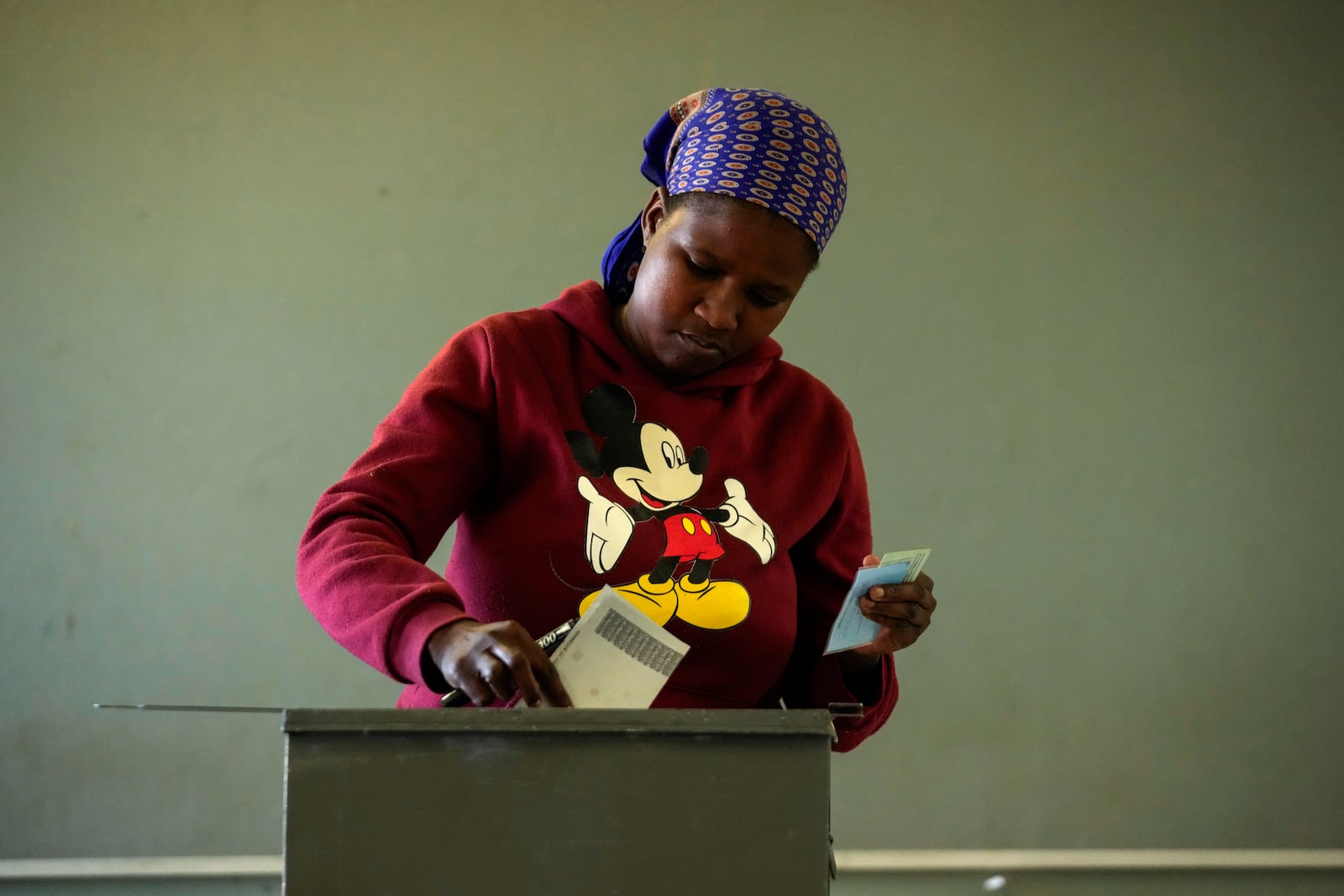 A woman casts her vote during the elections in Gaborone, Botswana, Wednesday, Oct. 30, 2024. (AP Photo/Themba Hadebe)