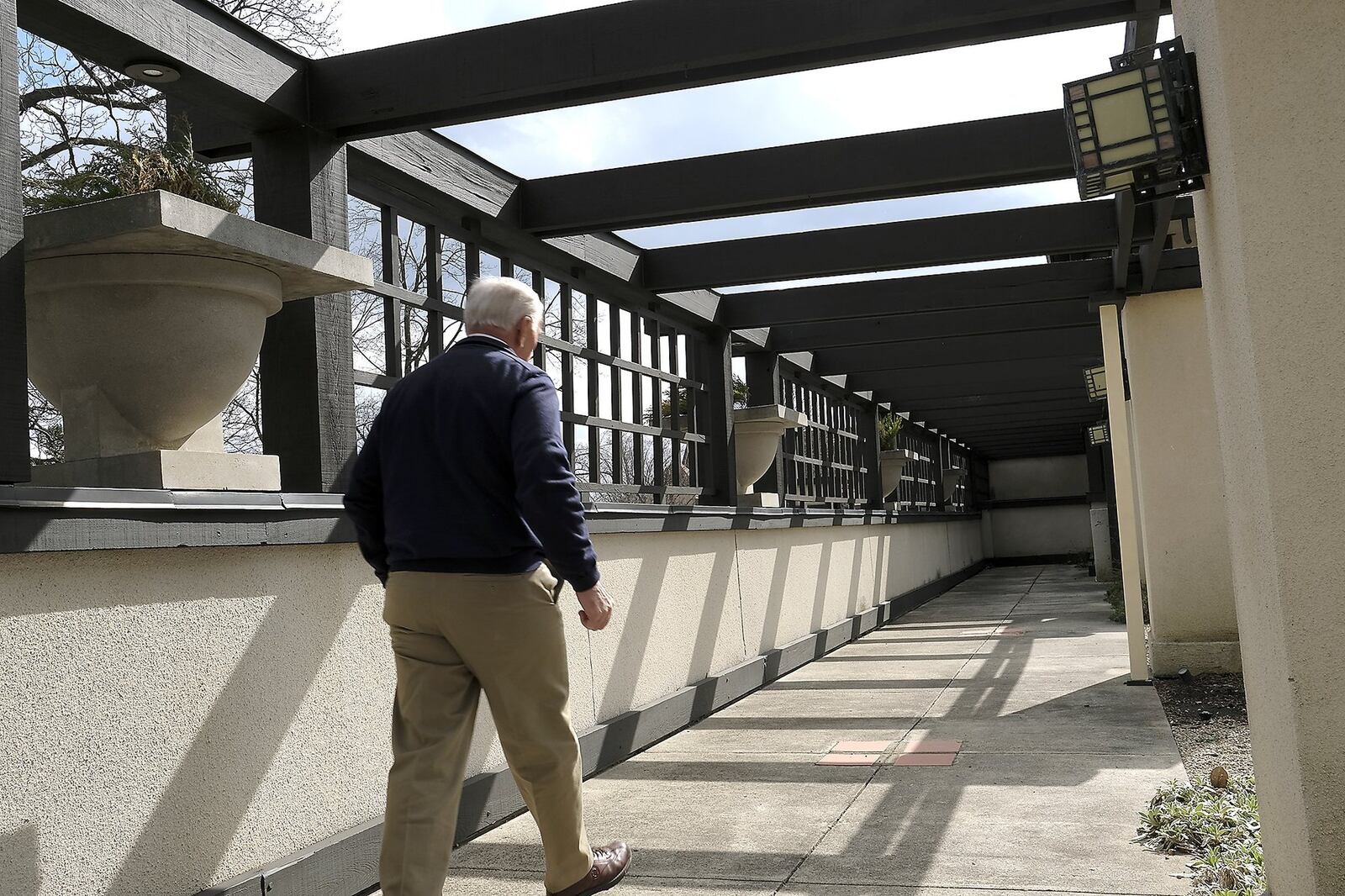 Tom Fyffe, director of museum operations at the Wescott House, walks under the pergola that the museum plans to repair with the $15,000 grant. BILL LACKEY/STAFF