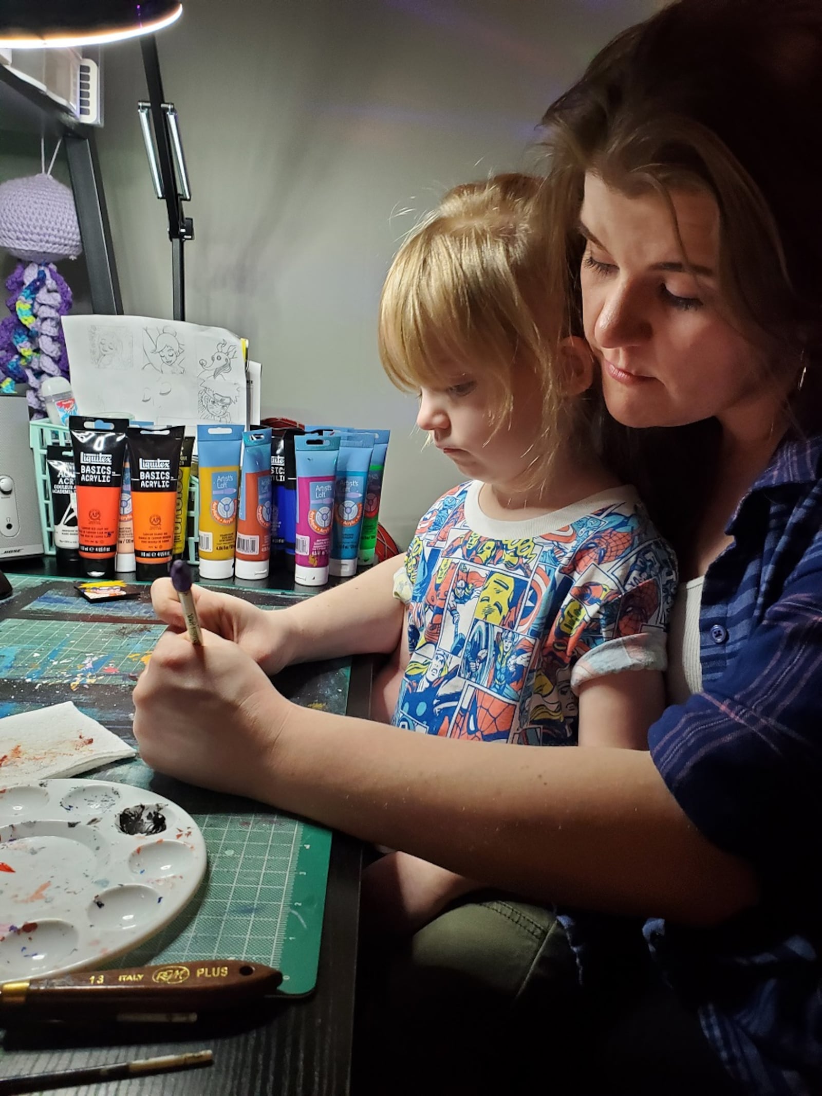 Lindsey Ray, pictured here with her 3-year-old daughter, Rose, has been drawing since she was “old enough to hold a pencil.” CONTRIBUTED