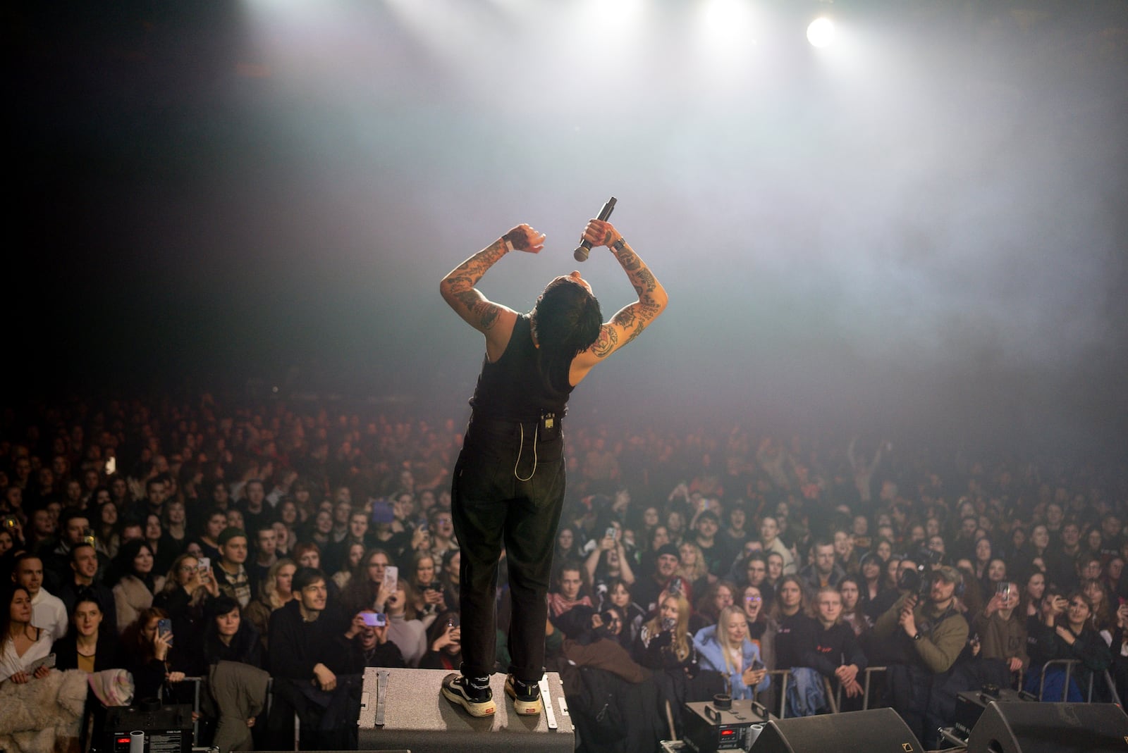 Dmytro Odnorozhenko, solo singer of punk rock band Hatespeech sings during the presentation of the music album Epoch, a collaboration between Ukrainian artists and the 3rd Assault Brigade, in Kyiv, Ukraine, Saturday, Dec. 7, 2024. (AP Photo/Alex Babenko)