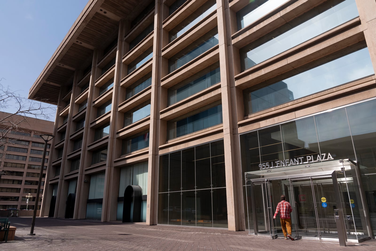 A man enters the building that houses the offices of the Institute of Museum and Library Services (IMLS), Thursday, March 20, 2025, in Washington. (AP Photo/Jacquelyn Martin)