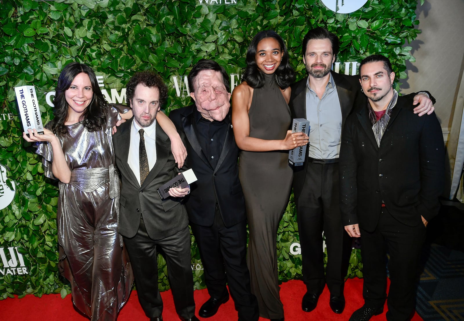 From left, Vanessa McDonnell, Aaron Schimberg, Adam Pearson, Gabriel Mayers, Sebastian Stan and Mike Marino pose with the best feature award for "A Different Man" during The Gothams Film Awards at Cipriani Wall Street on Monday, Dec. 2, 2024, in New York. (Photo by Evan Agostini/Invision/AP)