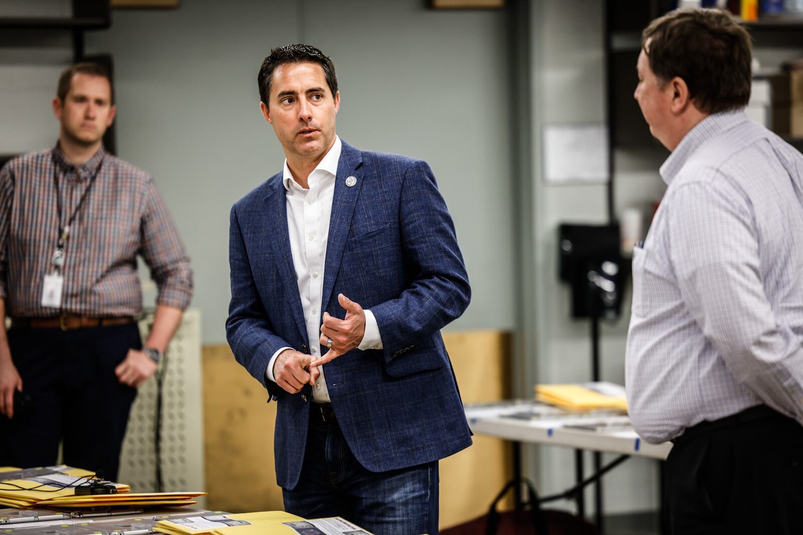 Director of the Montgomery County Board of Elections, Jeff Rezabek, right, fields questions by Ohio  Secretary of State, Frank LaRose at the Montgomery County Board of Elections Monday May 2, 2022.