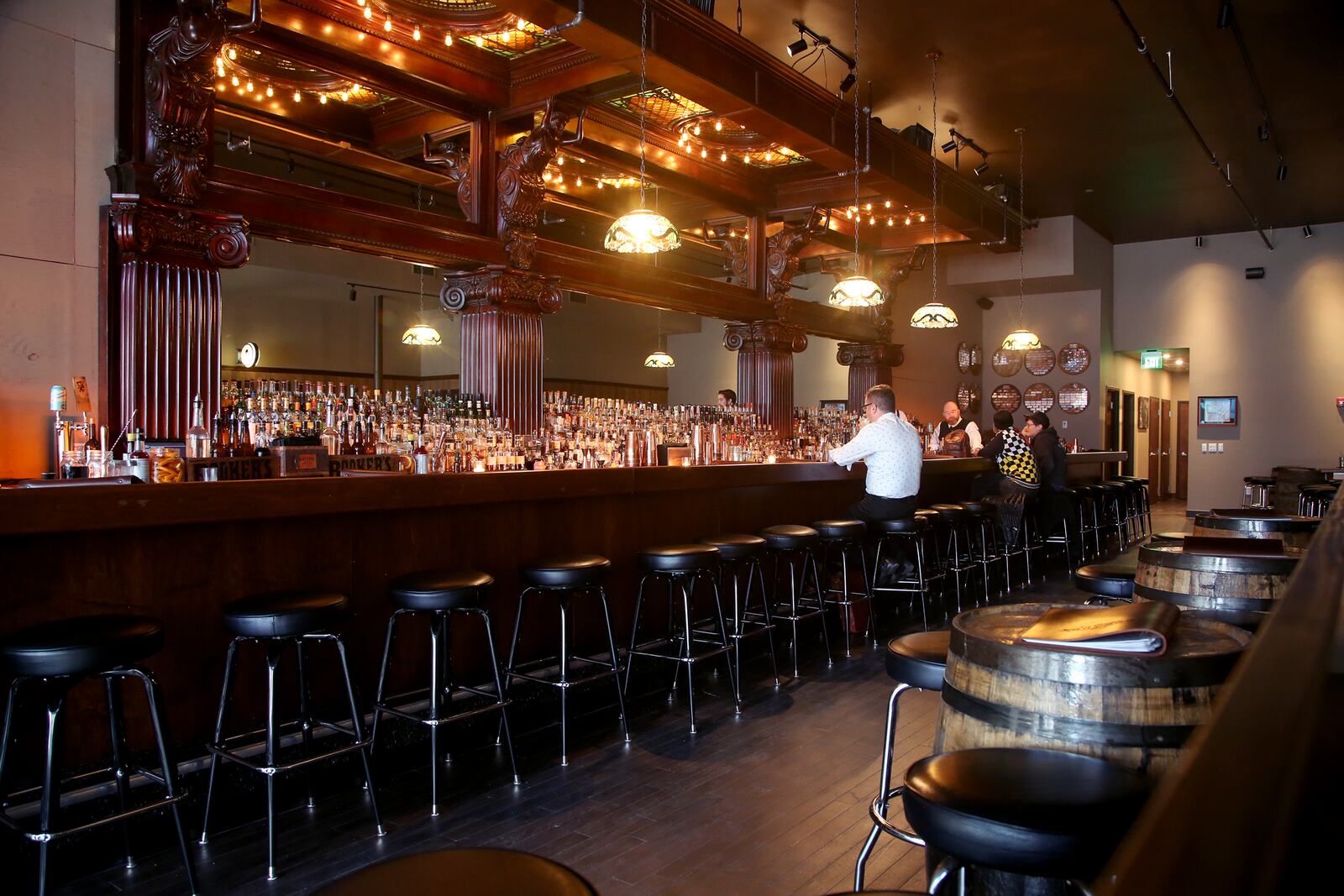 Daytonâs Century Bar has reopened in the three-story former Dayton Power and Light building, 18 S. Jefferson St. The historic cherry wood bar, the centerpiece of the original Century Bar, has been restored and installed in the new expanded space. Century Bar is co-owned by Diane Spitzig and Joseph Head.   LISA POWELL / STAFF