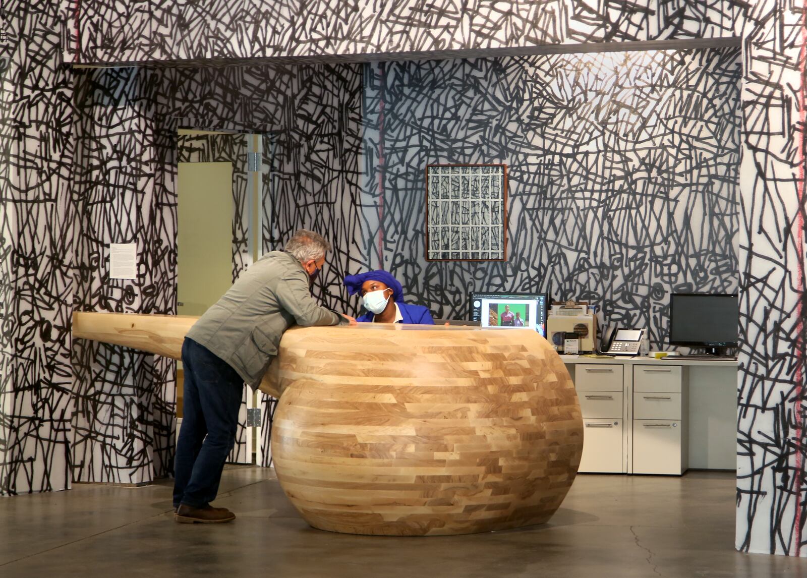 The Co commissioned artist Shon Walters to create a reception desk for their new home in The Arcade. The piece is made from ash trees that fell in the 2019 tornadoes. LISA POWELL / STAFF