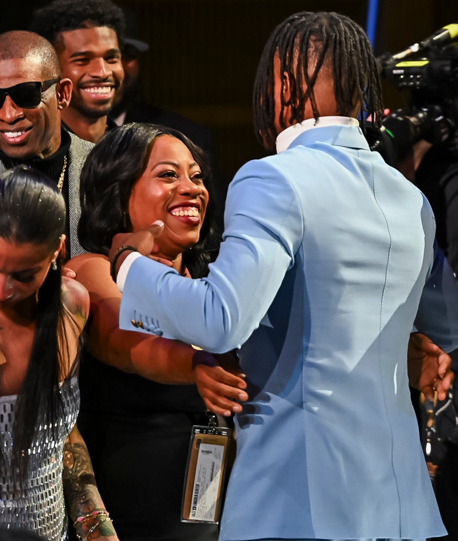 Colorado’s Travis Hunter and his mom Ferrante Edmonds embrace after Travis won the Heisman Trophy as the outstanding player in college football, Saturday, Dec. 14, 2024, in New York. (Todd Van Emst/Heisman Trust via AP, Pool)