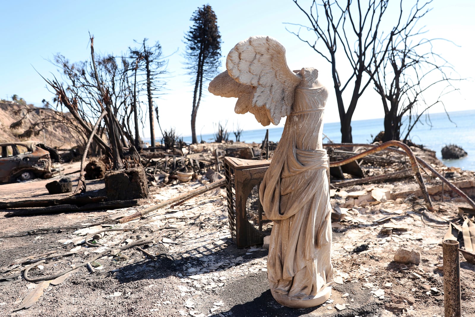 A sculpture is all that remains at a burned homesite during the aftermath of the Palisades Fire along Pacific Coast Highway in Malibu, Calif., Sunday, Jan. 12, 2025. (Scott Strazzante/San Francisco Chronicle via AP)