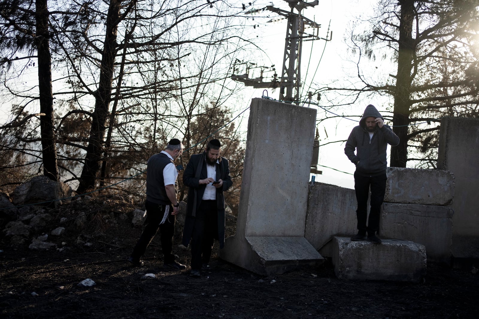 Ultra-Orthodox Jewish men tour northern Israel, near the border with Lebanon, during a ceasefire, Tuesday, Dec. 3, 2024. (AP Photo/Maya Alleruzzo)