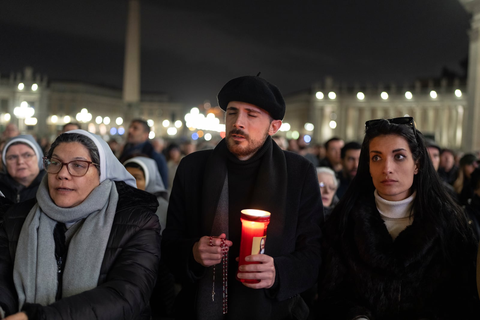 Catholic faithful attend a nightly rosary prayer service for the health of Pope Francis in St. Peter's Square at the Vatican. (AP Photo/Mosa'ab Elshamy)