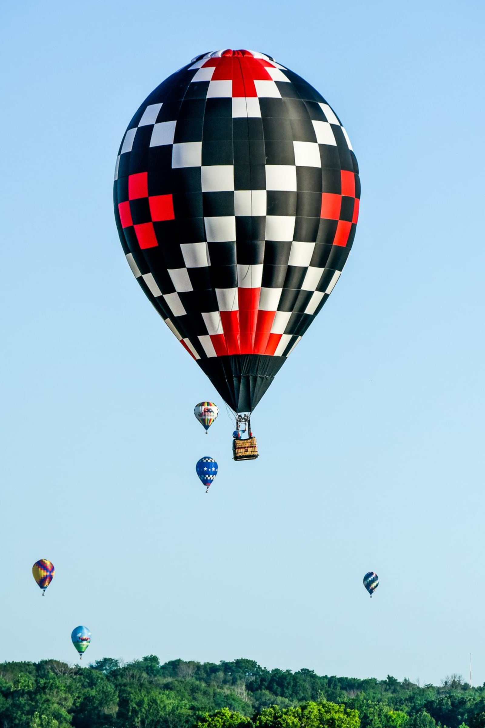 Competition balloons fly over Hook Field during the 2016 Ohio Challenge Hot Air Balloon Festival at Smith Park in Middletown. NICK GRAHAM/STAFF