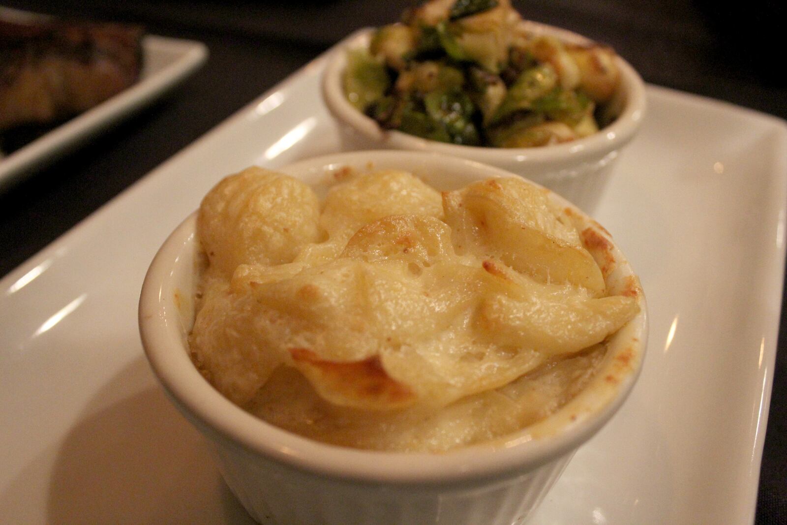 The Bison and The Boar in West Alexandria will celebrate its opening Friday, Feb. 22.  Pictured: sides of Mac and Cheese and roasted Brussel Sprouts .