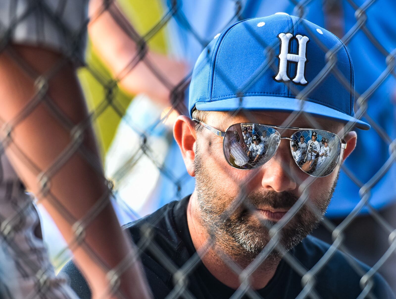 West Side Little League manager Kenny Coomer talks to his players in the dugout during a game in 2018. WSLL on Friday clinched a spot in the Little League World Series in Williamsport, Pa. NICK GRAHAM/STAFF