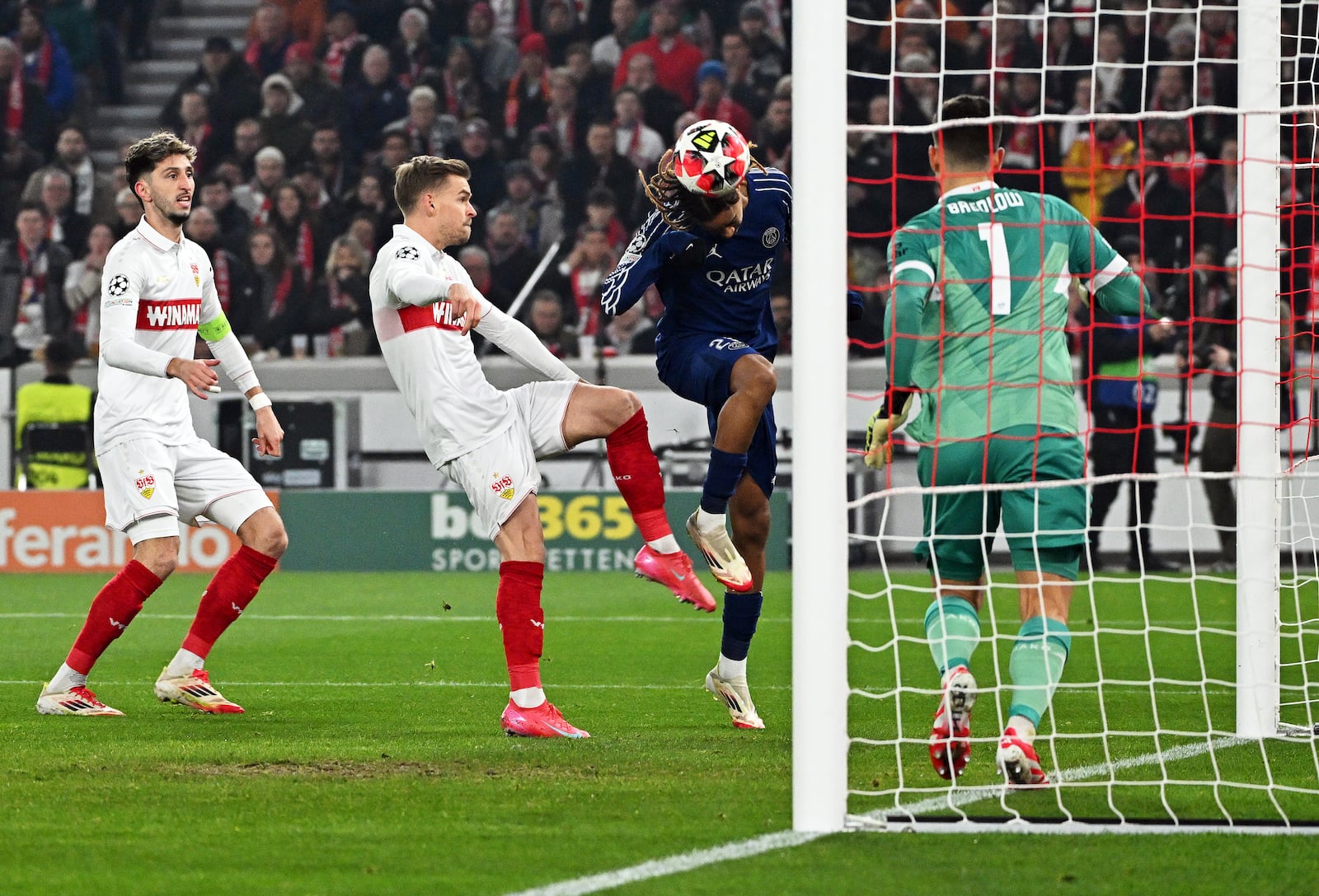 PSG's Bradley Barcola, centre right, scores the opening goal past Stuttgart's goalkeeper Fabian Bredlow during the Champions League opening phase soccer match between VfB Stuttgart and Paris Saint-Germain in Stuttgart, Germany, Jan. 29, 2025. (Marijan Murat/dpa via AP)