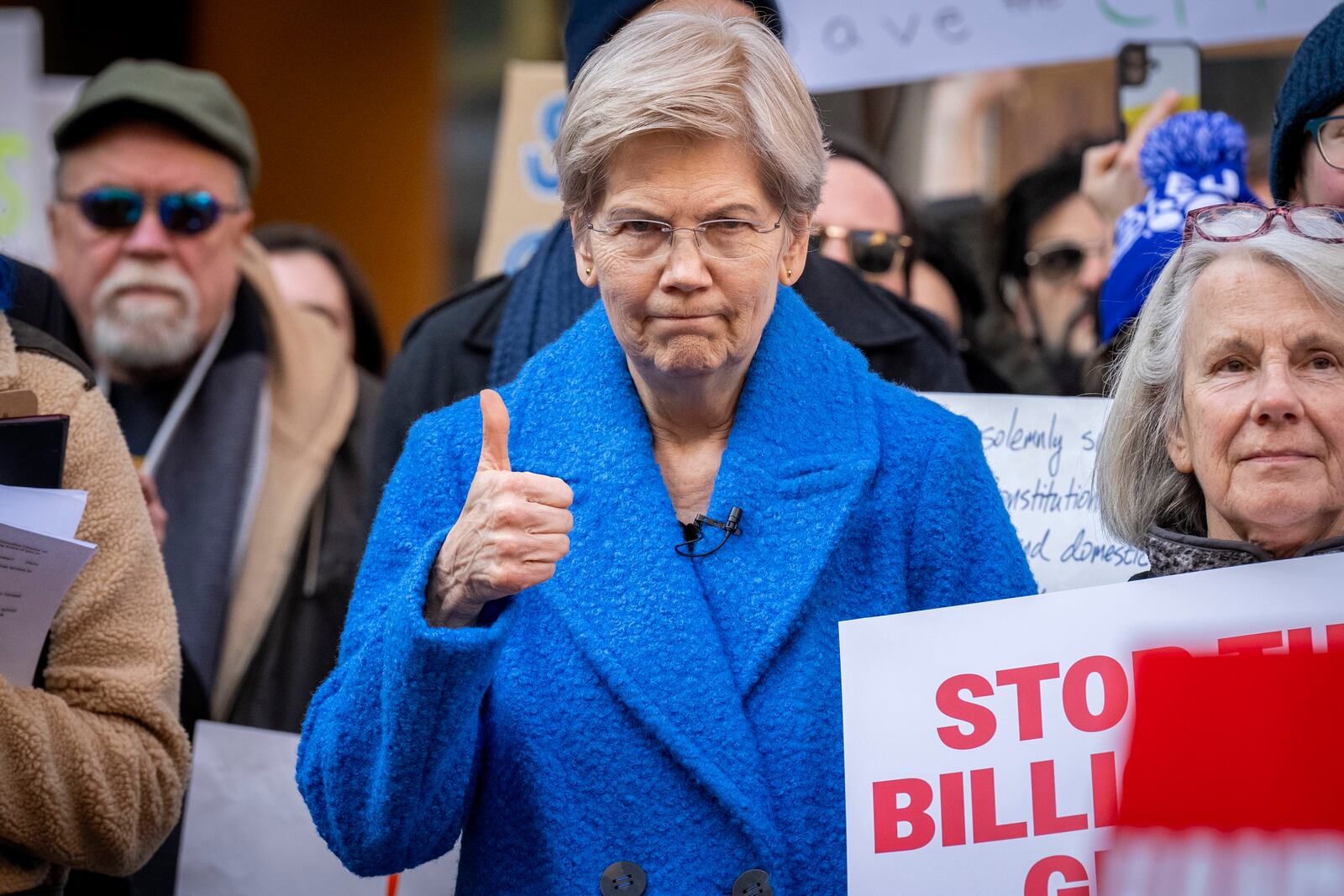 Sen. Elizabeth Warren, D-Mass., makes the thumbs up sign while attending a protest in support of the Consumer Financial Protection Bureau (CFPB) at their headquarters, Monday, Feb. 10, 2025, at the CFPB in Washington. (AP Photo/Jacquelyn Martin)