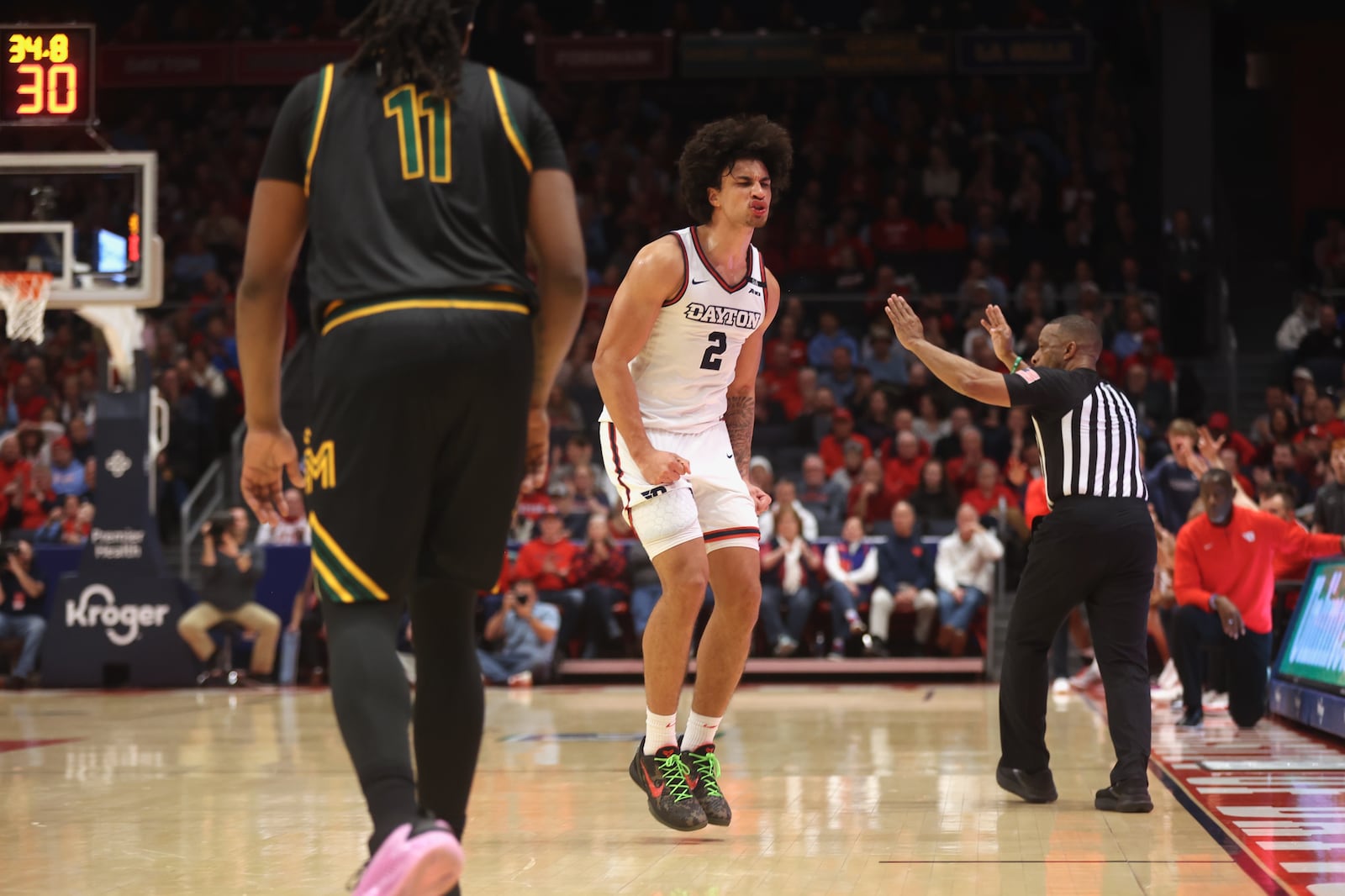 Dayton's Nate Santos celebrates after making a 3-pointer against George Mason in the first half on Wednesday, Jan. 15, 2025, at UD Arena. David Jablonski/Staff