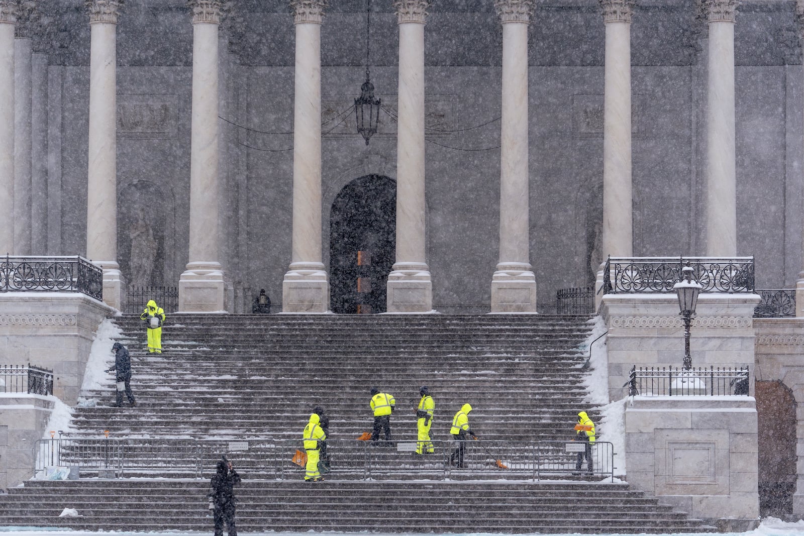 FILE - Workers clear steps at the Capitol in Washington, Monday, Jan. 6, 2025. (AP Photo/J. Scott Applewhite, File)