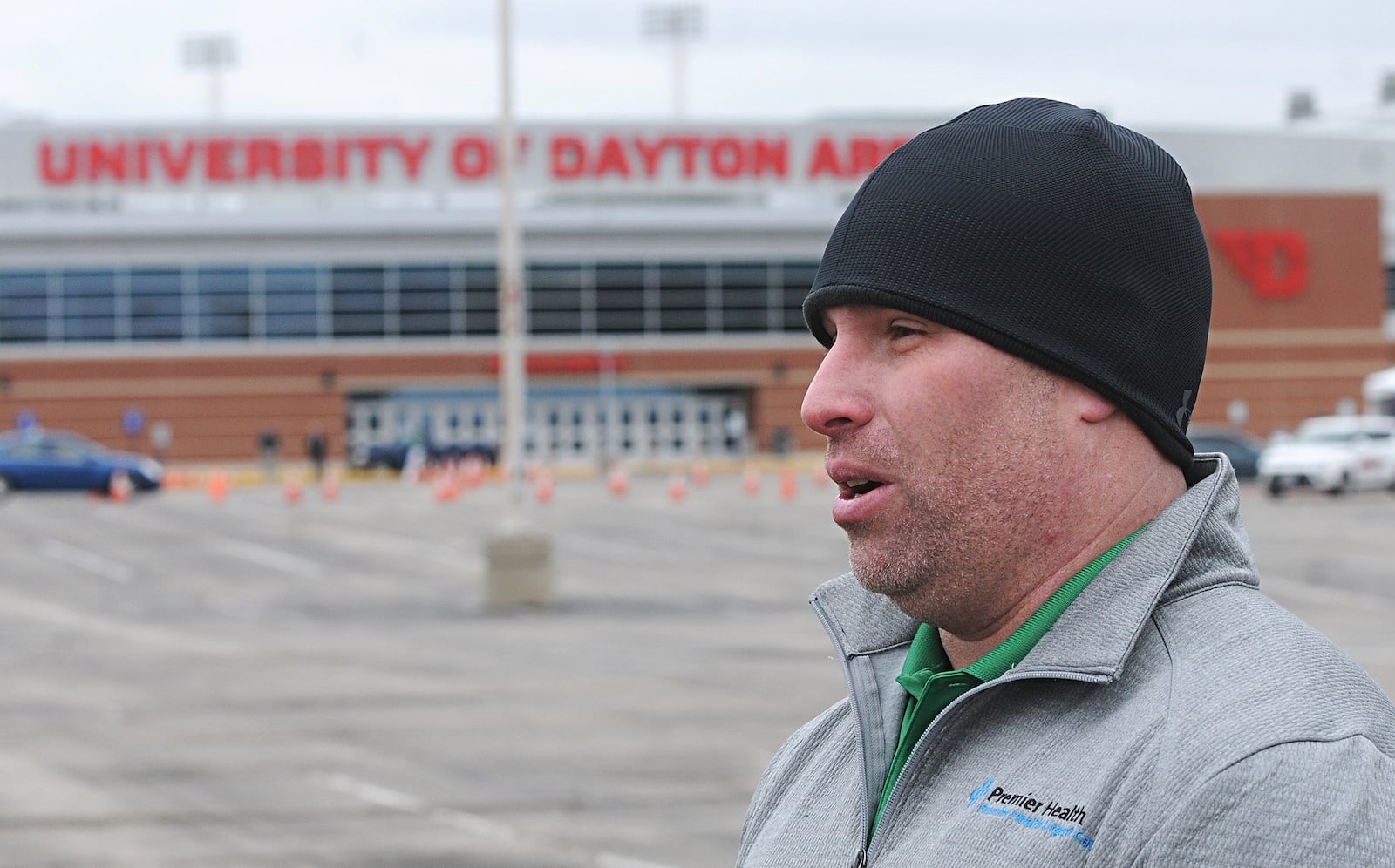 Dr. Joseph Allen, regional medical director for Premier Health, talks about the first day of drive-up testing at the University of Dayton Arena parking lot on Tuesday. MARSHALL GORBY\STAFF