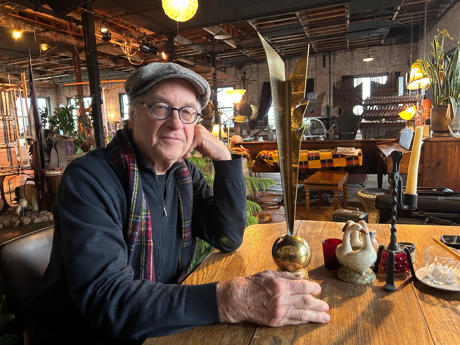 Michael Bashaw with his prototype of the Dayton Literary Peace Prize. “It’s an abstract quill and parchment with the word ‘peace’ engraved in 350 languages. I feel privileged that all these authors have it now.”