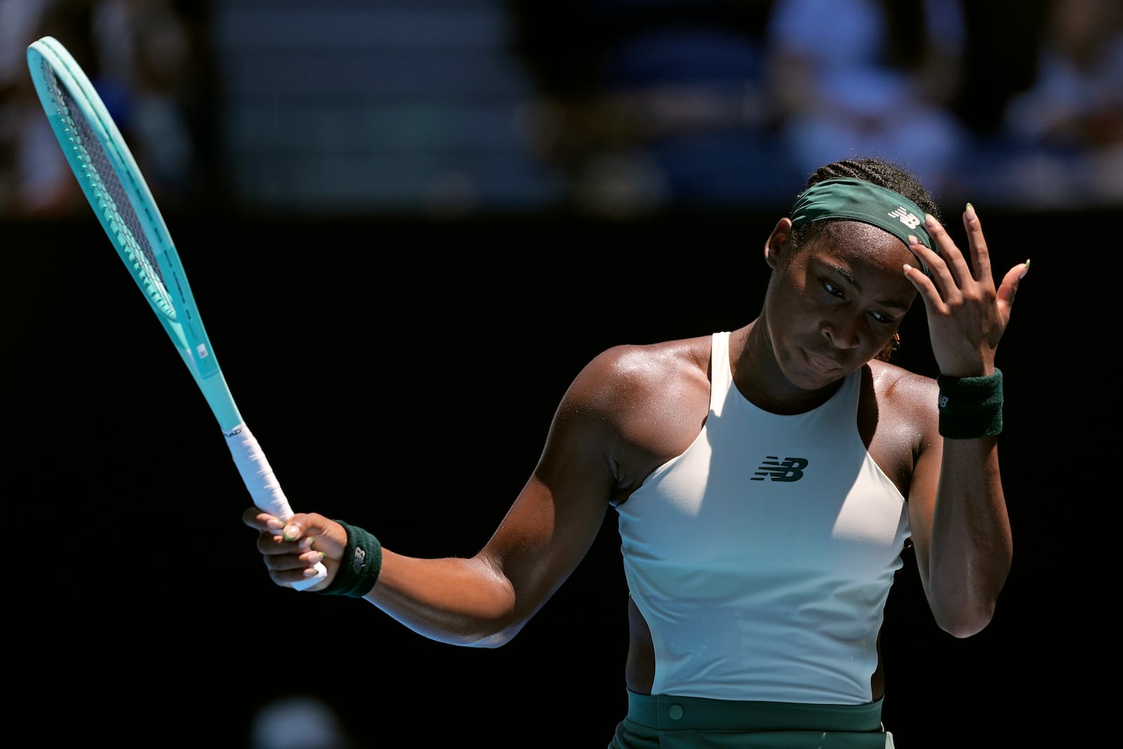 Coco Gauff of the U.S. reacts during her quarterfinal match against Paula Badosa of Spain at the Australian Open tennis championship in Melbourne, Australia, Tuesday, Jan. 21, 2025. (AP Photo/Ng Han Guan)