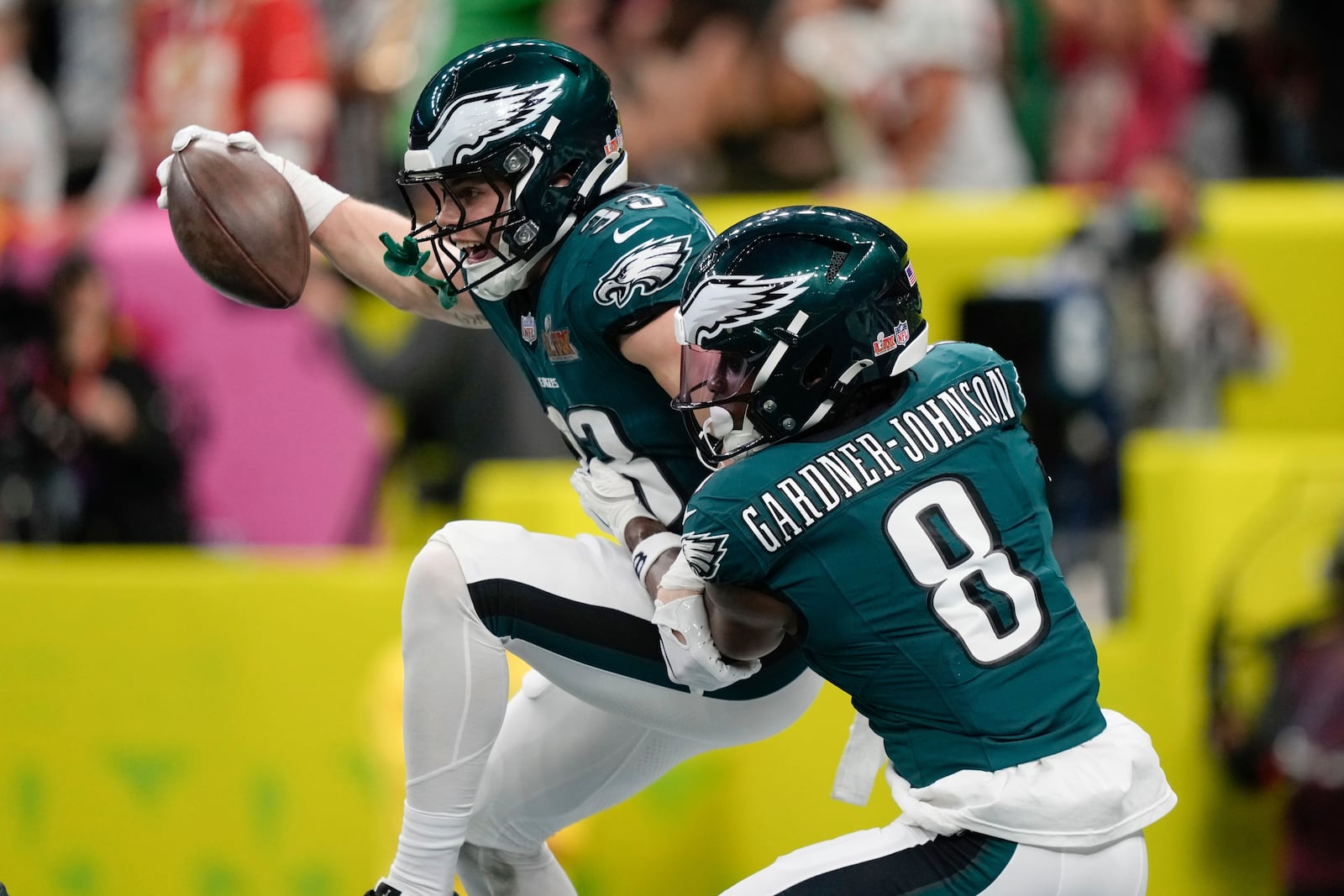 Philadelphia Eagles defensive back Cooper DeJean (33) celebrates with safety C.J. Gardner-Johnson (8) after intercepting a pass and scoring a touchdown during the first half of the NFL Super Bowl 59 football game, Sunday, Feb. 9, 2025, in New Orleans. (AP Photo/Matt Slocum)