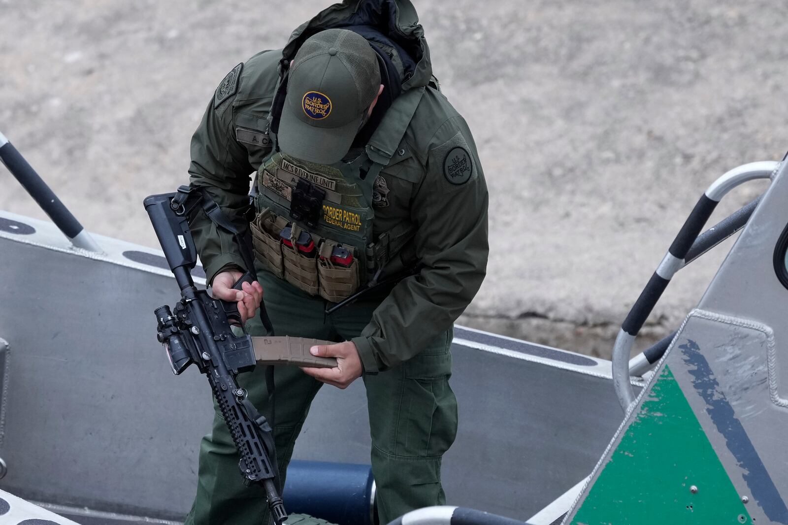 A border patrol agent prepares to patrol along the Rio Grande, Thursday, Feb. 13, 2025, in McAllen, Texas. (AP Photo/Eric Gay)