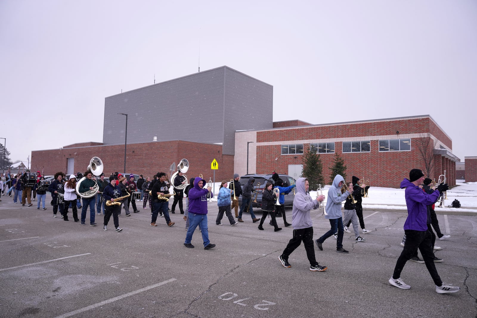 Students in the Middletown High School band practice outside, Tuesday, Jan. 14, 2025, in Middletown, Ohio. The band is set to participate in the inauguration of President-elect Donald Trump on Jan. 20. Middletown is the hometown of Vice President-elect JD Vance.(AP Photo/Kareem Elgazzar)