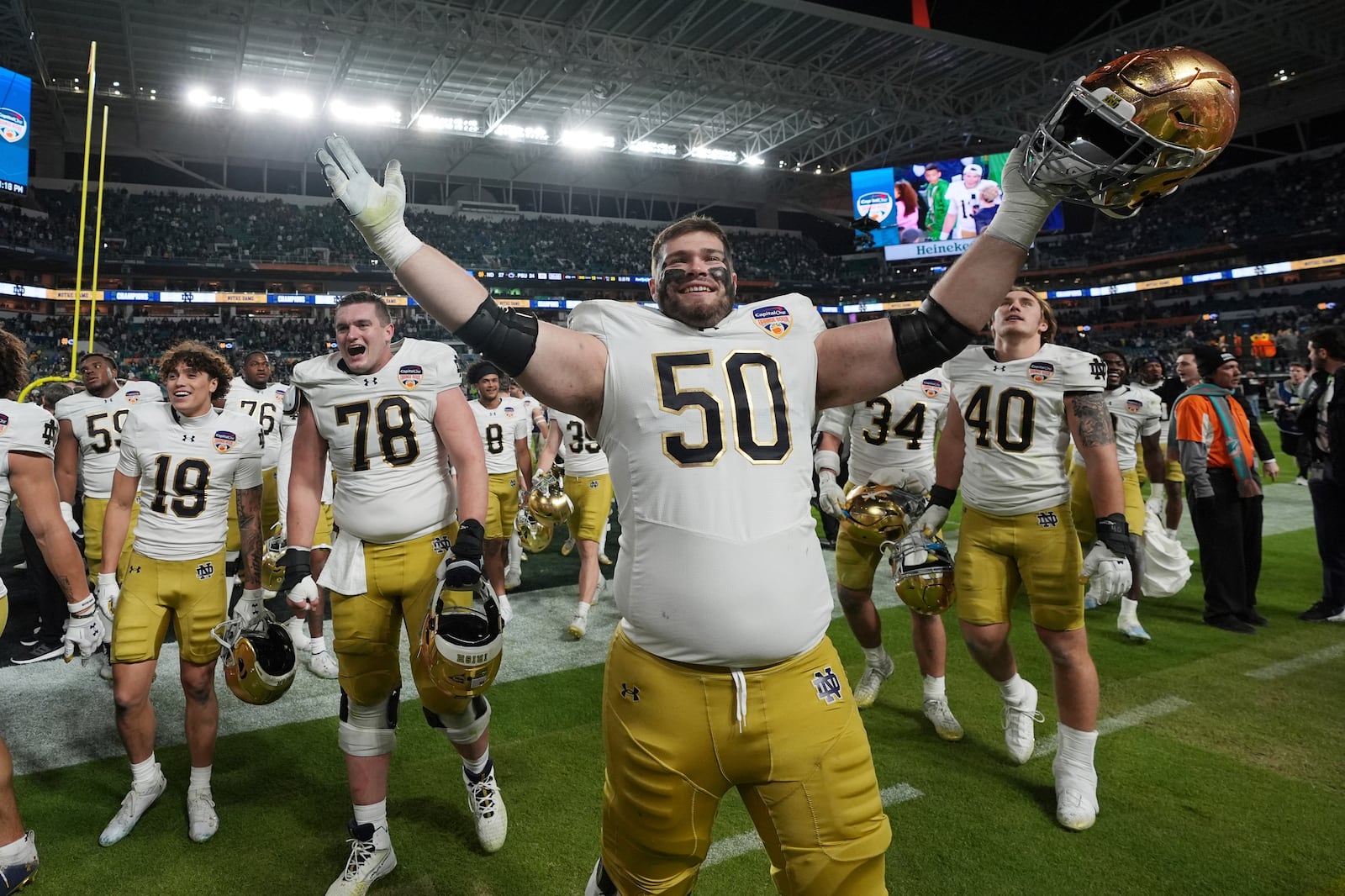 Notre Dame offensive lineman Rocco Spindler (50) celebrates at the end of the Orange Bowl College Football Playoff semifinal game against Penn State, Thursday, Jan. 9, 2025, in Miami Gardens, Fla. (AP Photo/Rebecca Blackwell)