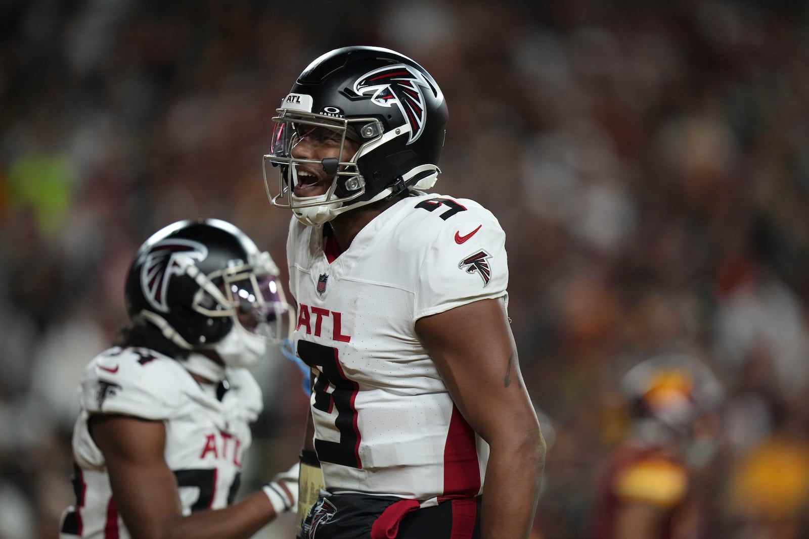 Atlanta Falcons quarterback Michael Penix Jr. (9) celebrates a touchdown during the second half of an NFL football game against the Washington Commanders, Sunday, Dec. 29, 2024, in Landover, Md. (AP Photo/Stephanie Scarbrough)