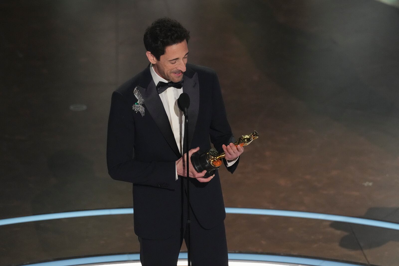 Adrien Brody accepts the award for best performance by an actor in a leading role for "The Brutalist" during the Oscars on Sunday, March 2, 2025, at the Dolby Theatre in Los Angeles. (AP Photo/Chris Pizzello)