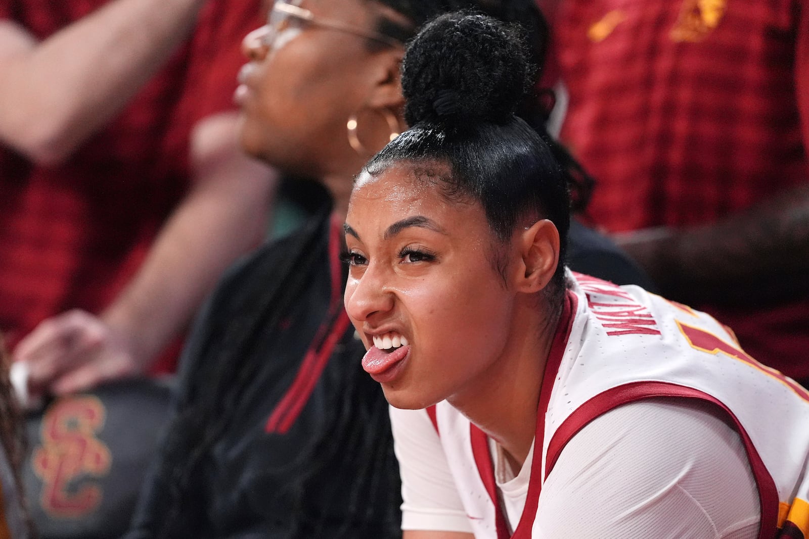 Southern California guard JuJu Watkins takes a breather after being taken out of the game in the final seconds of the second half of an NCAA college basketball game against Michigan, Sunday, Dec. 29, 2024, in Los Angeles. (AP Photo/Mark J. Terrill)