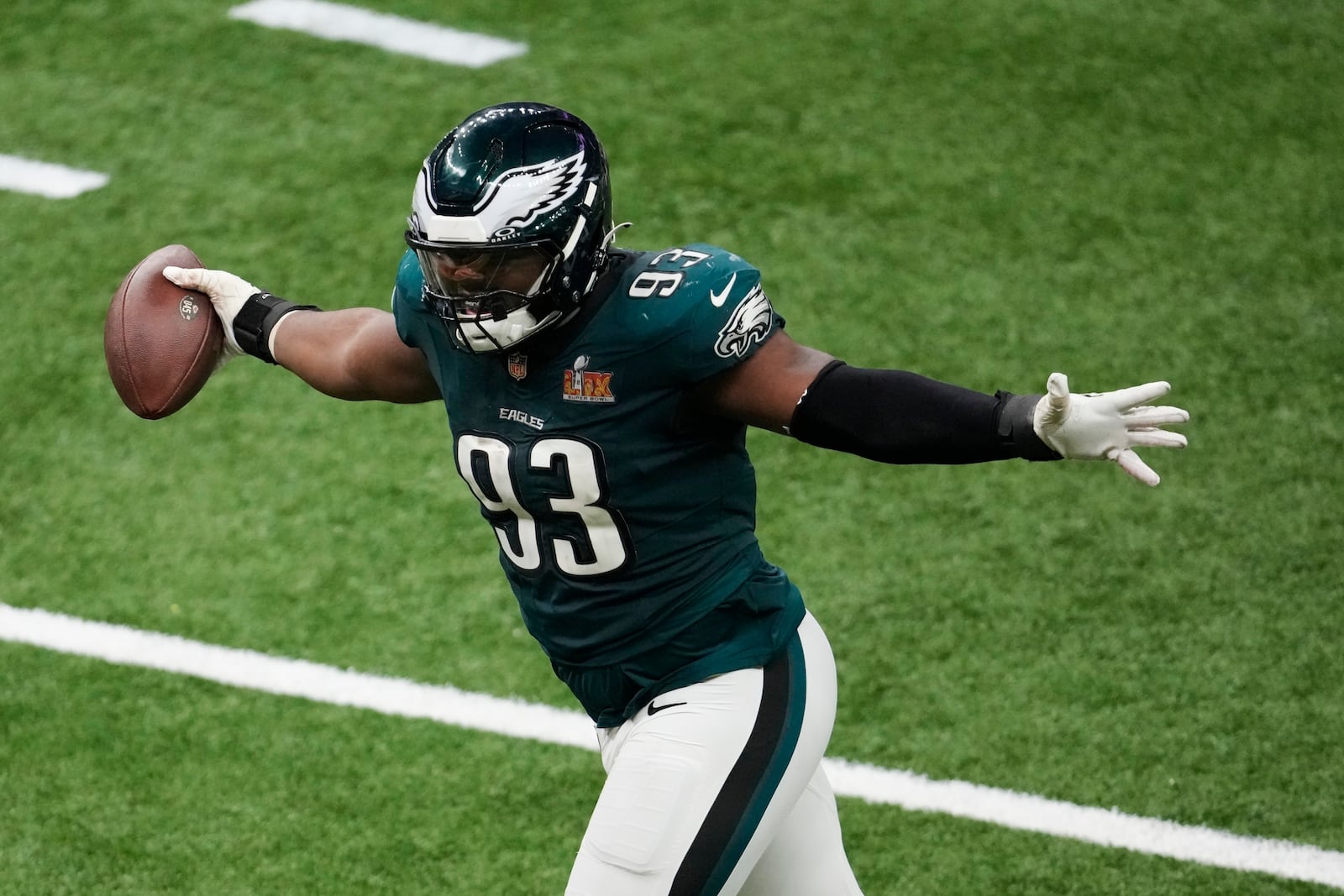 Philadelphia Eagles defensive tackle Milton Williams (93) celebrates his fumble recovery against the Kansas City Chiefs during the second half of the NFL Super Bowl 59 football game, Sunday, Feb. 9, 2025, in New Orleans. (AP Photo/Gerald Herbert)