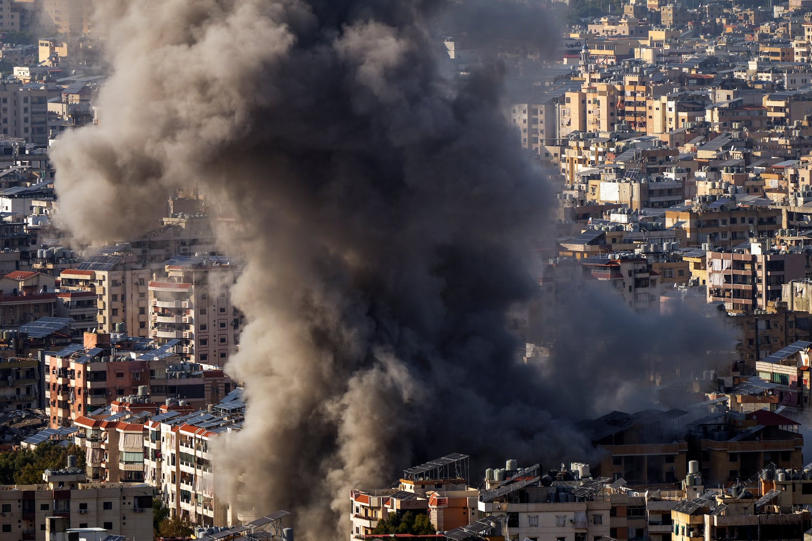 Smoke rises after an Israeli airstrike on Dahiyeh, in the southern suburb of Beirut, Lebanon, Saturday, Nov. 23, 2024. (AP Photo/Hassan Ammar)